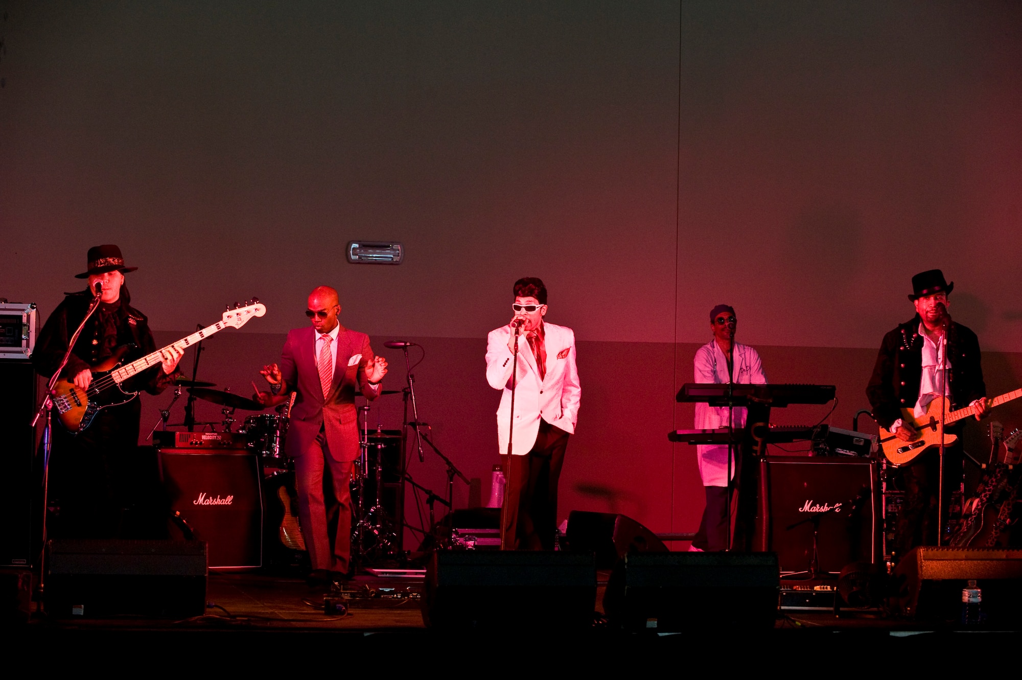 Purple Reign performs during the End of Summer Bash at the Warrior Fitness Center Aug. 23, 2013, at Nellis Air Force Base, Nev. Purple Reign is a Prince Tribute band hired by the 99th Force Support Squadron for this event. About 1, 200 Airmen, spouses and children came to commemorate the last weekend of summer break for children. (U.S. Air Force photo by Senior Airman Matthew Lancaster)