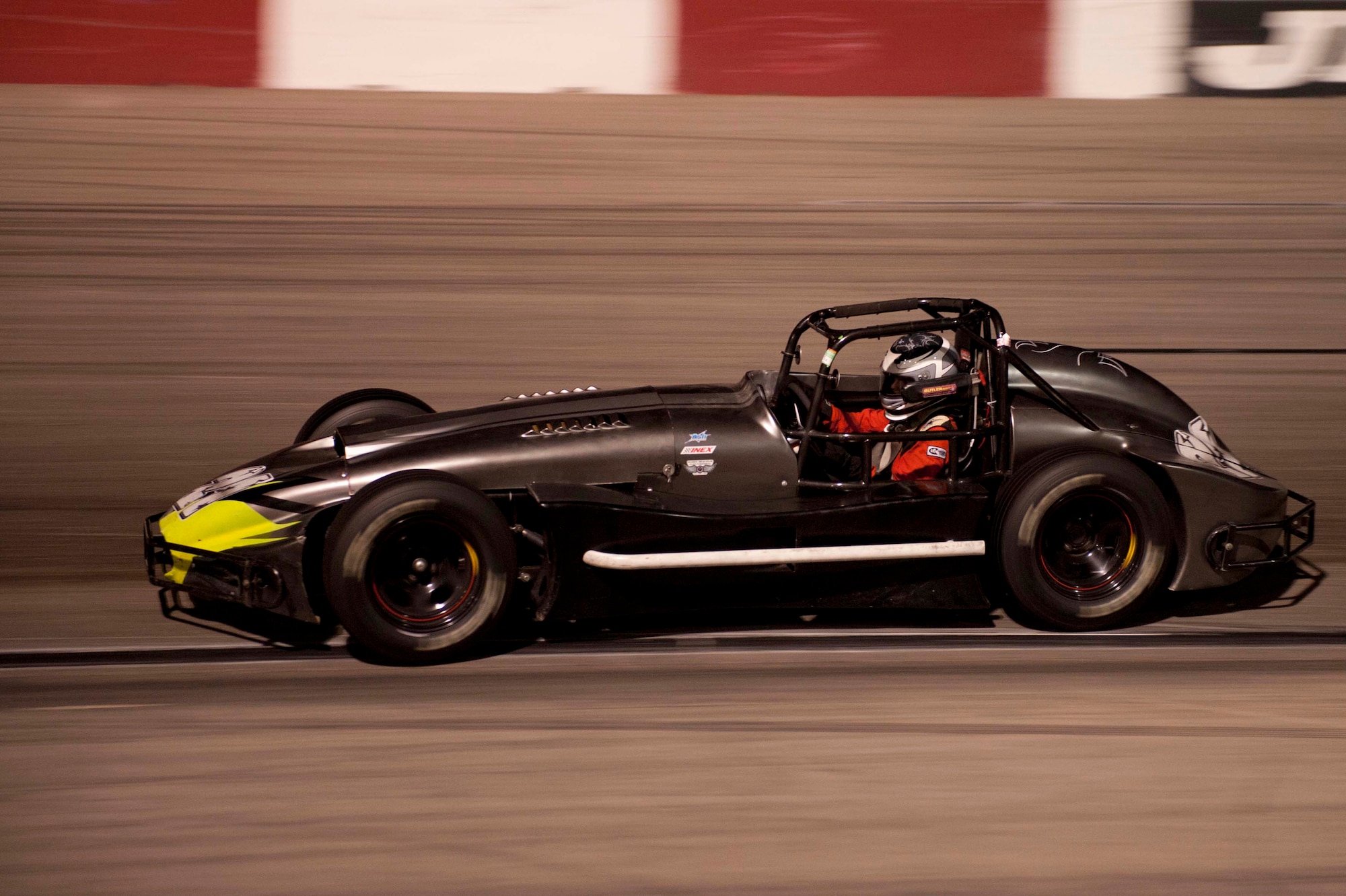 Number 21 Thunder Roadster Ian Anderson holds the lead position during a race Aug. 24, 2013, at the Las Vegas Motor Speedway Bullring, Las Vegas. Ian Anderson won the race, adding another win to his undefeated record of 21-0, at the Las Vegas Motor Speedway’s Bullring. Ian is the son of Master Sgt. Cristy Anderson, 53rd Test and Evaluation Group first sergeant. (U.S. Air Force photo by Airman 1st Class Timothy Young)