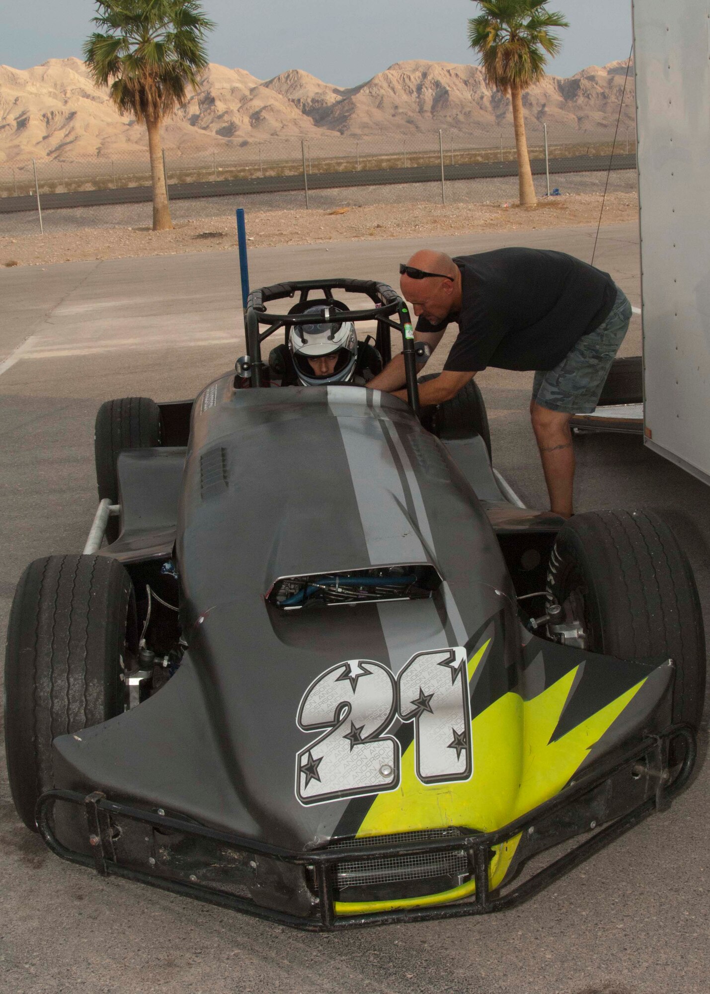Mark Anderson secures his son Ian Anderson’s five point harness before he test drives his Thunder Roadster Aug. 24, 2013, at the Las Vegas Motor Speedway, Las Vegas. A five point harness is designed to reduce the amount of dangerous movement the body exerts during a crash as well as keep the driver from being thrown from their car. Ian is the son of Master Sgt. Cristy Anderson, 53rd Test and Evaluation Group first sergeant. (U.S. Air Force photo by Airman 1st Class Timothy Young)