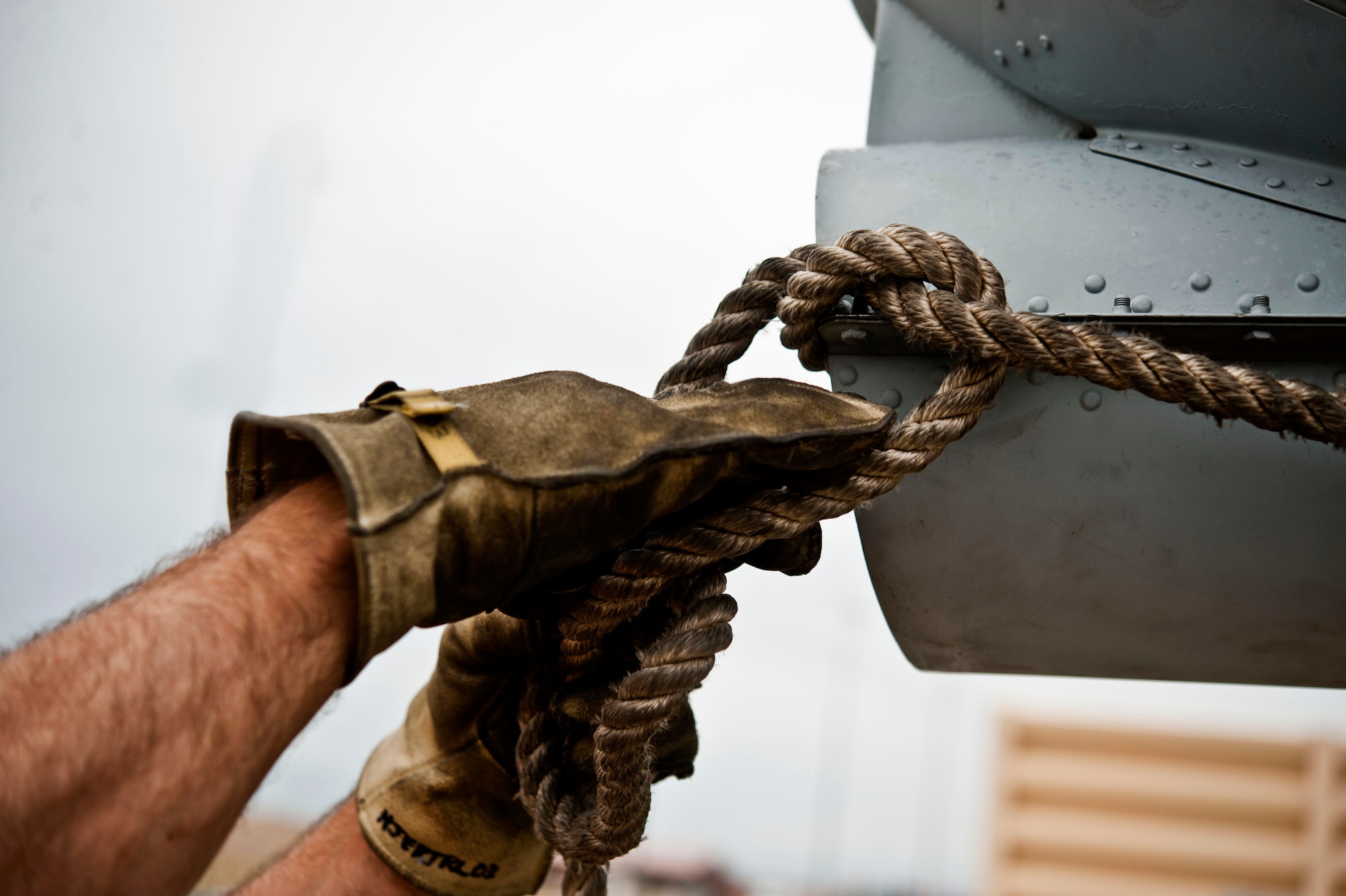 A 57th Maintenance Squadron crash recovery technician fastens down an A-10 Thunderbolt II fuselage from the 57th Aircraft Maintenance Squadron Thunder Aircraft Maintenance Unit Aug. 26, 2013, at Nellis Air Force Base, Nev. The crash recovery team lifted and secured the fuselage onto a flatbed truck, which will take the fuselage of the A-10 to the Nevada Test and Training Range where it will be used as a lasing target by pilots on training missions. (U.S. Air Force photo by Senior Airman Daniel Hughes)