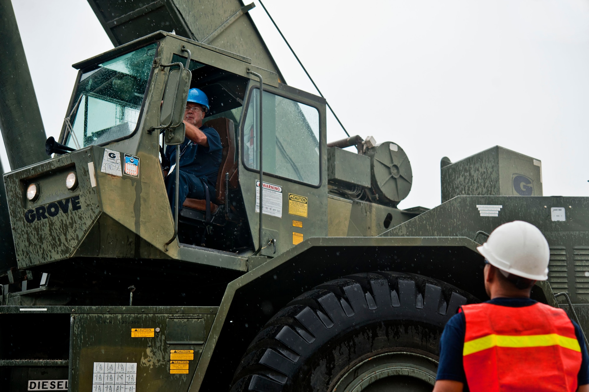 Tom Ziegenbein, 57th Maintenance Squadron crash recovery technician, operates a crane during the movement of a ground training A-10 Thunderbolt II fuselage from the 57th Aircraft Maintenance Squadron Thunder Aircraft Maintenance Unit Aug. 26, 2013, at Nellis Air Force Base, Nev. Members from the crash recovery team loaded the fuselage onto a flatbed truck for transportation to the Nevada Test and Training Range where it will be used as a lasing target by pilots on training missions. (U.S. Air Force photo by Senior Airman Daniel Hughes)