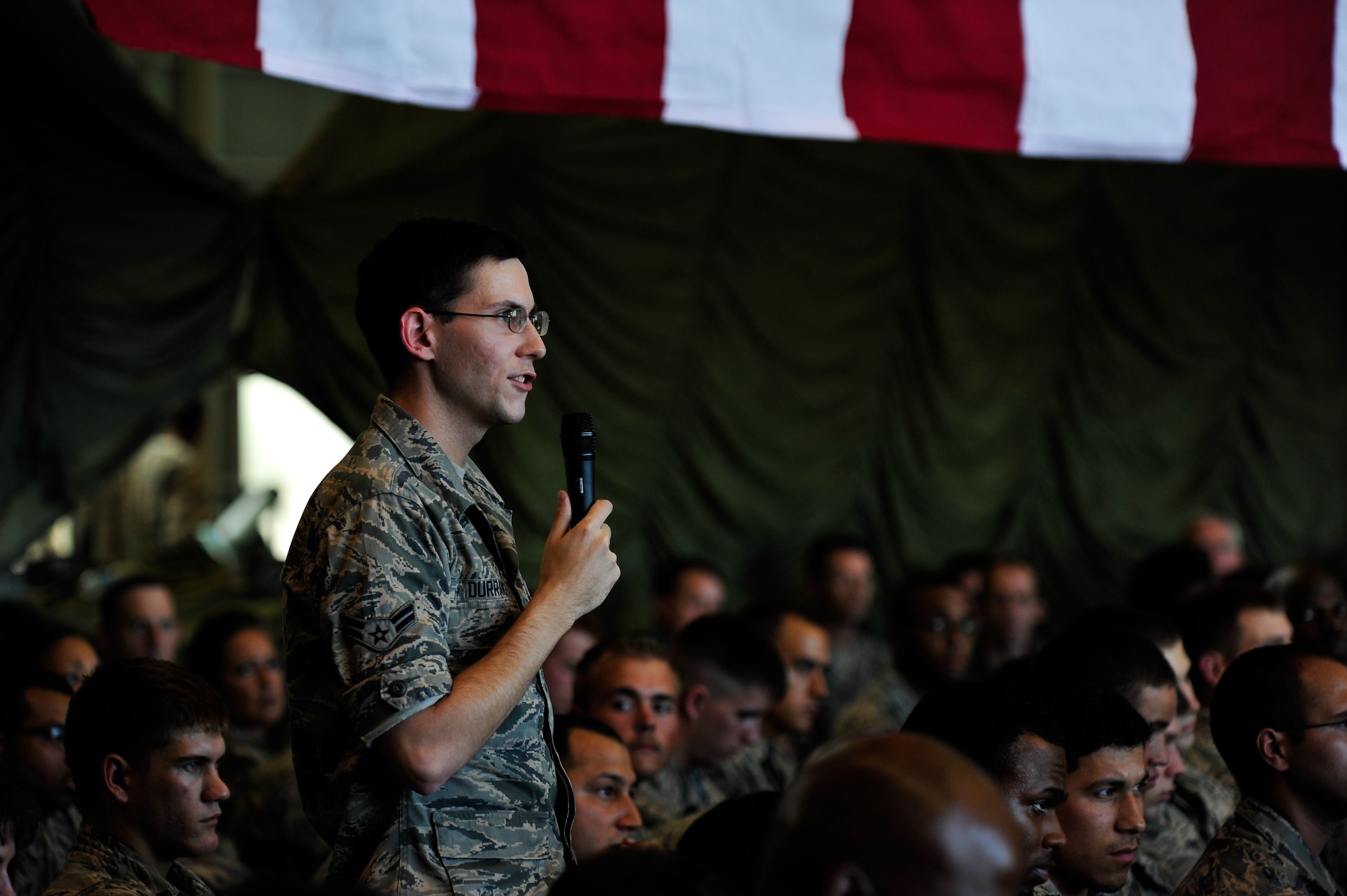 Airman 1st Class Corey Durrance asks a question to Air Force Chief of Staff Mark A. Welsh III during an Airman’s call, at Yokota Air Base, Japan, Aug. 27, 2013. During their time at Yokota, Welsh and Chief Master Sergeant of the Air Force James Cody thanked Airmen for their service and talked with them about issues affecting the Air Force. (U.S. Air Force photo by Senior Airman Cody H. Ramirez) 