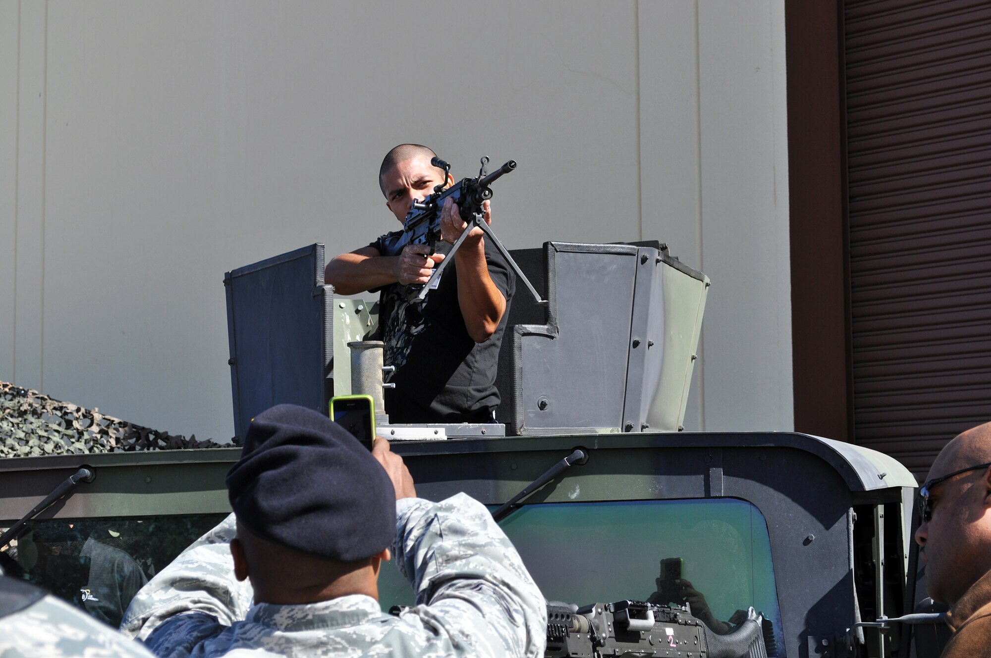 TRAVIS AIR FORCE BASE, Calif. -- An employer of a Travis reservist gets to take aim with one of the 349th Security Forces Squadron weapons from the turret of a Humvee at a past 349th Air Mobility Wing Employer Appreciation Day. (U.S. Air Force photo by Senior Master Sgt. Ellen Hatfield) 