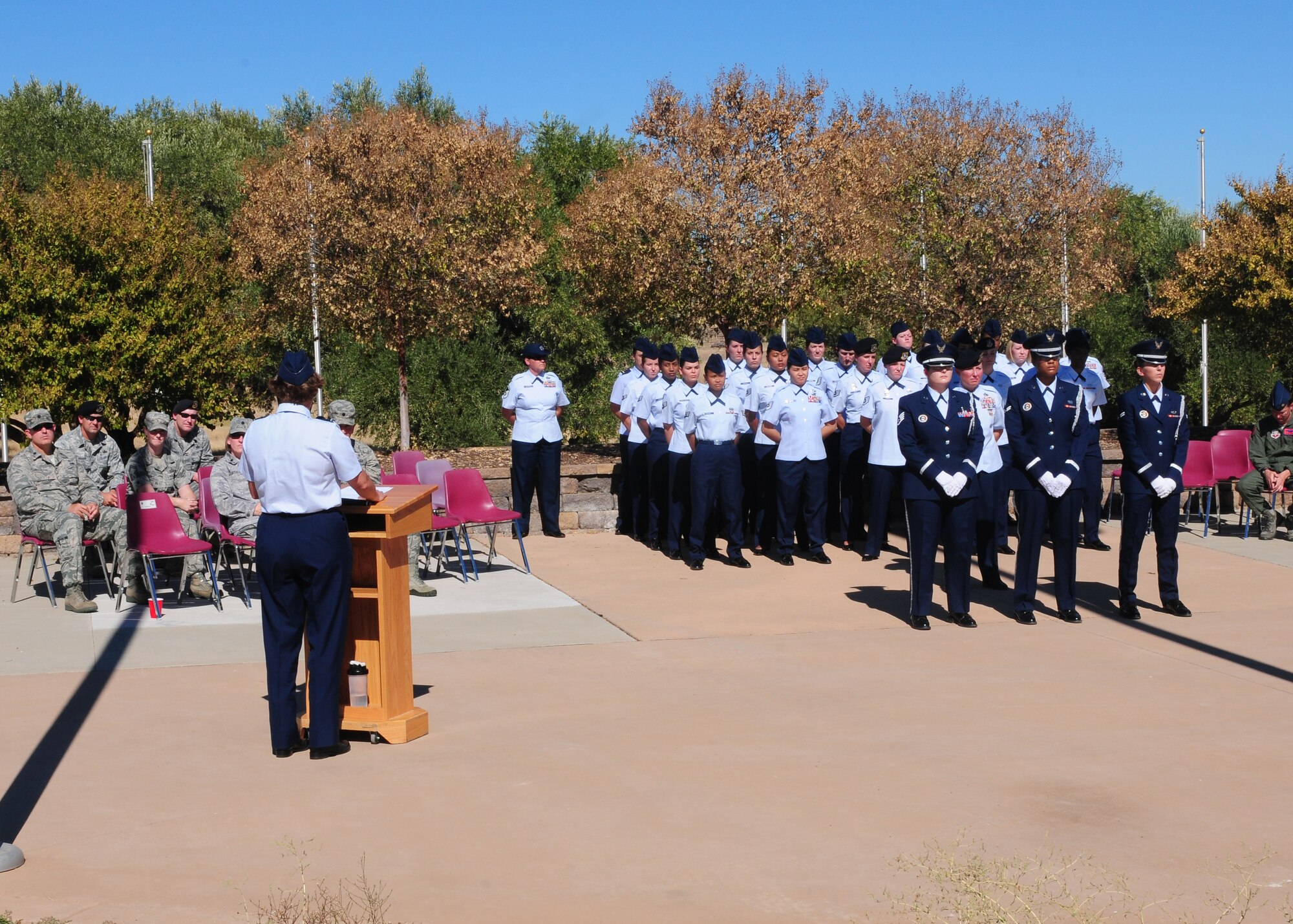 Col. Jody Ocker, 9th Medical Group commander, speaks to members of Team Beale during a retreat ceremony honoring Women’s Equality Day at Beale Air Force Base, Calif., Aug. 26, 2013. There was an all-female flight and honor guard team for the event. (U.S. Air Force photo by Senior Airman Allen Pollard/Released)