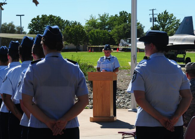 Col. Jody Ocker, 9th Medical Group commander, speaks to members of Team Beale during a retreat ceremony honoring Women’s Equality Day at Beale Air Force Base, Calif., Aug. 26, 2013. The Women’s Suffrage Amendment was introduced for the first time to the United States Congress on Jan. 10, 1878.  It was re-submitted numerous times until finally in June 1919 the amendment received approval from both the House of Representatives and the Senate. (U.S. Air Force photo by Senior Airman Allen Pollard/Released)