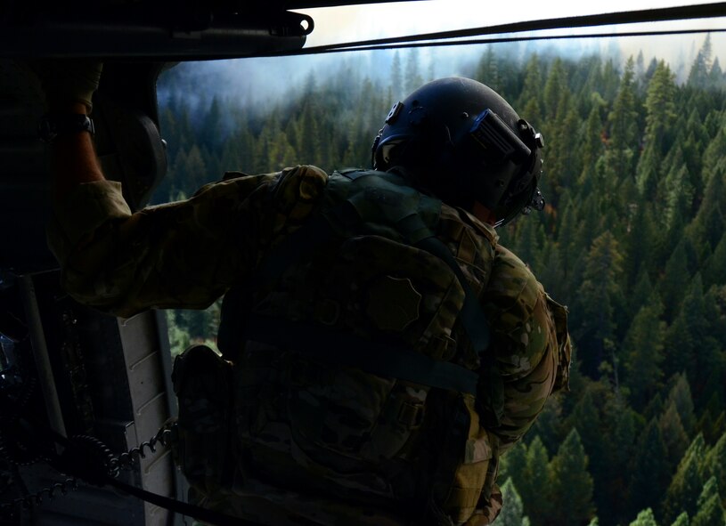 California Air National Guardsmen from the 129th Rescue Wing perform precision water bucket drops in support of the Rim Fire suppression operation at Tuolumne County near Yosemite, Calif., Aug. 26, 2013.  (Courtesy photo by Staff Sgt. Ed Drew)