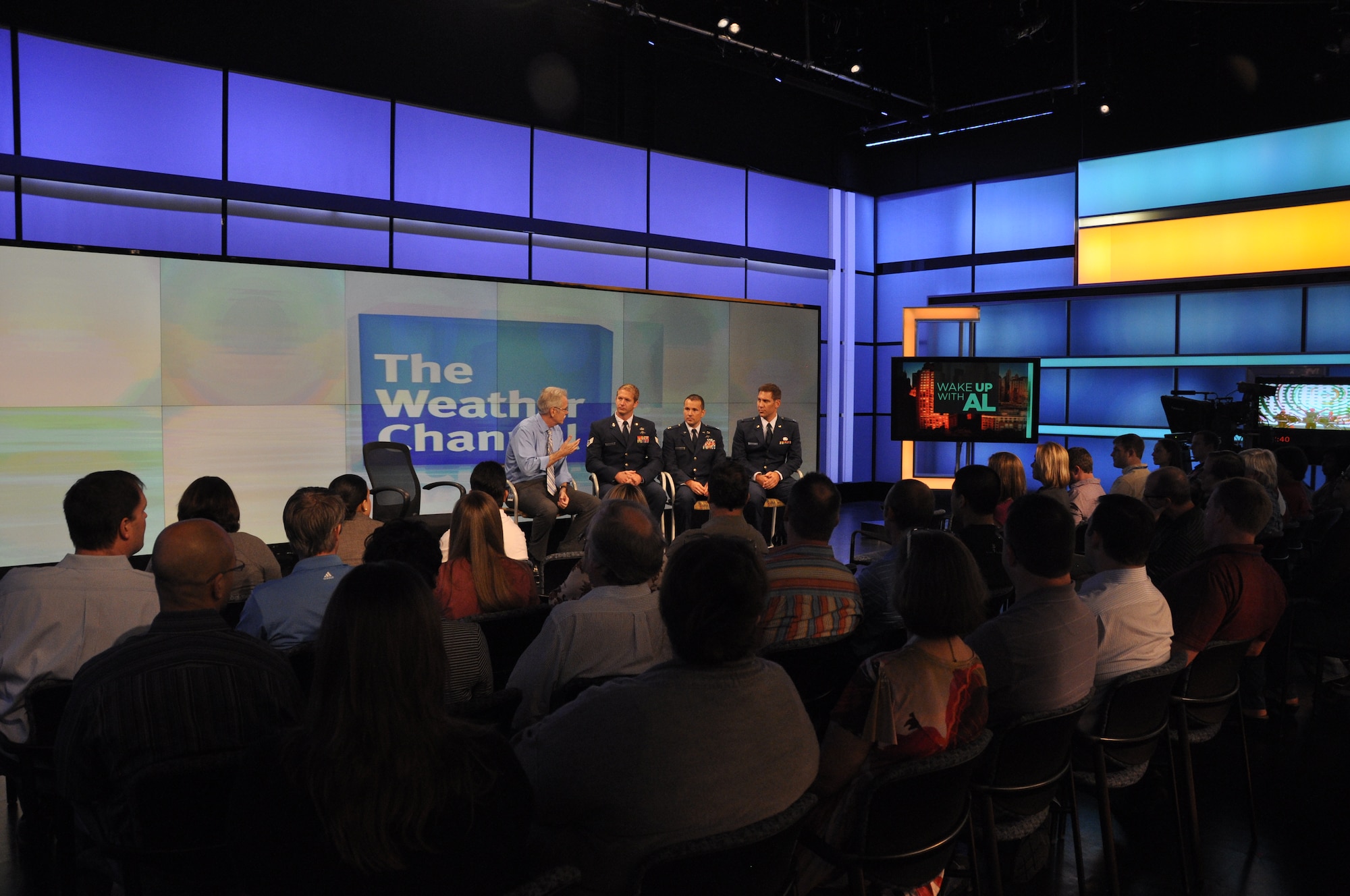 Paul Walsh, The Weather Channel producer and retired Air Force weatherman, facilitates a question and answer session with Special Operations Weather Team Airmen and The Weather Channel staff members Aug. 23, 2013 in Atlanta, Ga. Approximately 100 staff members participated in the session as Capt. Jonathan Sawtelle, 10th Combat Weather Squadron, and Staff Sgt. Travis Sanford, Special Tactics Training Squadron, described the responsibilities of SOWT Airmen and the challenges of observing and forecasting weather downrange. (U.S. Air Force photo by Capt. Victoria Porto) 
