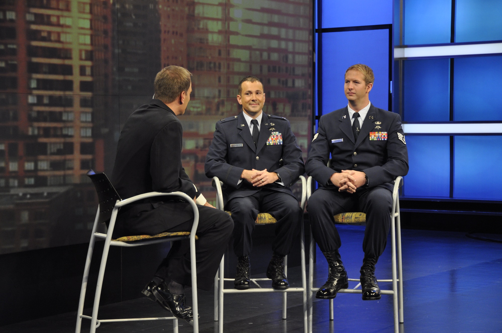 Mike Bettes, The Weather Channel TV personality, interviews Capt. Jonathan Sawtelle, 10th Combat Weather Squadron operations officer, and Staff Sgt. Travis Sanford, Special Tactics Training Squadron instructor, during the "Wake up with Al" morning show Aug. 23, 2013 in Atlanta, Ga. The interview focused on the Special Operations Weather Team career field and the challenges of observing and forecasting weather on the battlefield. (U.S. Air Force photo by Capt. Victoria Porto) 
