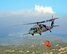 California Air National Guardsmen from the 129th Rescue Wing perform precision water bucket drops in support of the Rim Fire suppression operation at Tuolumne County near Yosemite, Calif., Aug. 26, 2013.  (Courtesy photo by Staff Sgt. Ed Drew)