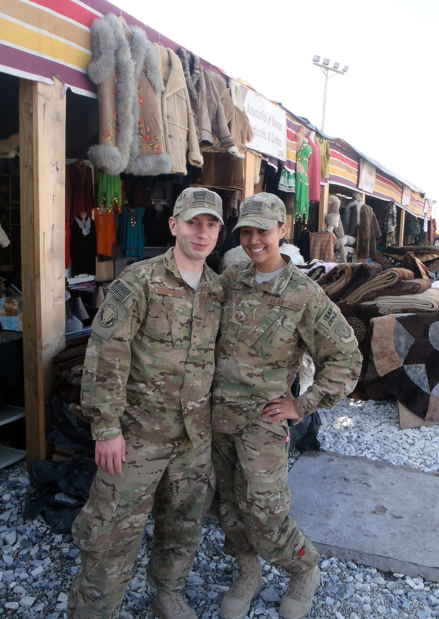 Tech. Sgt. Tyler Szymanski, or “Ski,” and Staff Sgt. Maria Szymanski, both 366th Surgical Operations Squadron medical technicians, visit a bazaar on Bagram Airfield, Afghanistan. The couple first deployed together in 2011, and again in 2013, and spent one week stationed on BAF together before Ski forward deployed with a Special Forces Operational Detachment Alpha in Kanduz Province, Afghanistan. (Courtesy photo) 