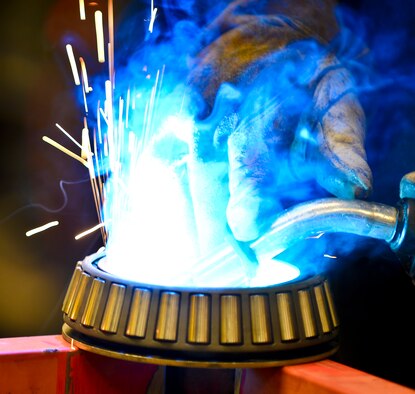 A rotational plate is welded together, Aug 22, 2013 at MacDill Air Force Base, Fla. Two Airmen from MacDill co-engineered a way to centrifugally mount a KC-135’s nose and main landing wheel on a rotating base, which reduces a wheel’s paint process by 50 percent. (U.S. Air Force photo/Staff Sgt. Brandon Shapiro)