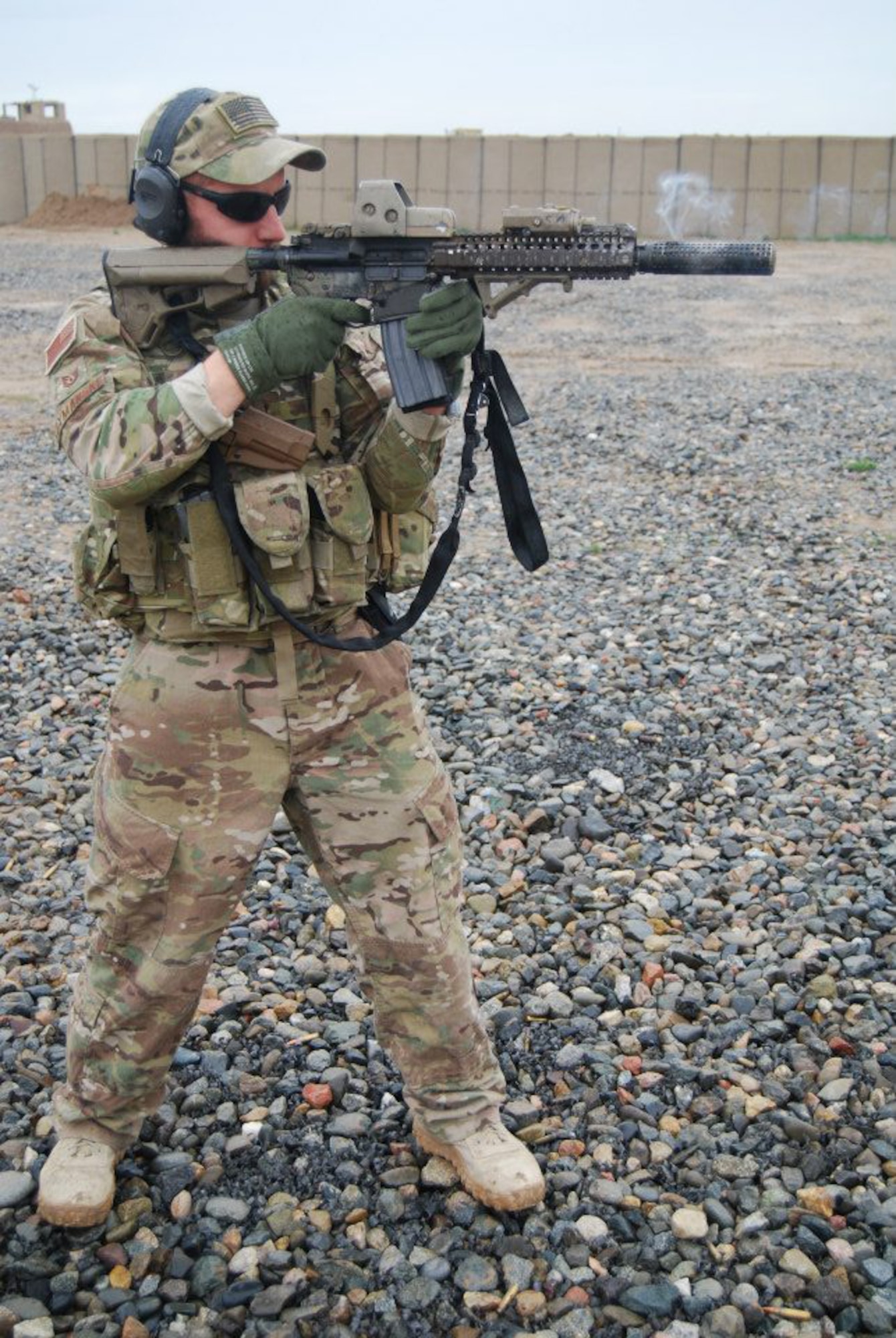 Air Force Tech. Sgt. Tyler Szymanski, a 366th Surgical Operations Squadron medical technician, deployed with a Special Forces Operational Detachment Alpha in Kanduz Province, Afghanistan, practices firing one of his many service weapons at a forward operating base in northern Afghanistan. Szymanski, a Eugene, Ore., native, frequently found himself embedded with small, 8-10 man, Special Forces teams, and would insert onto a battlefield a few days ahead of infantry units to set up a forward surgical team on location. (Courtesy photo)