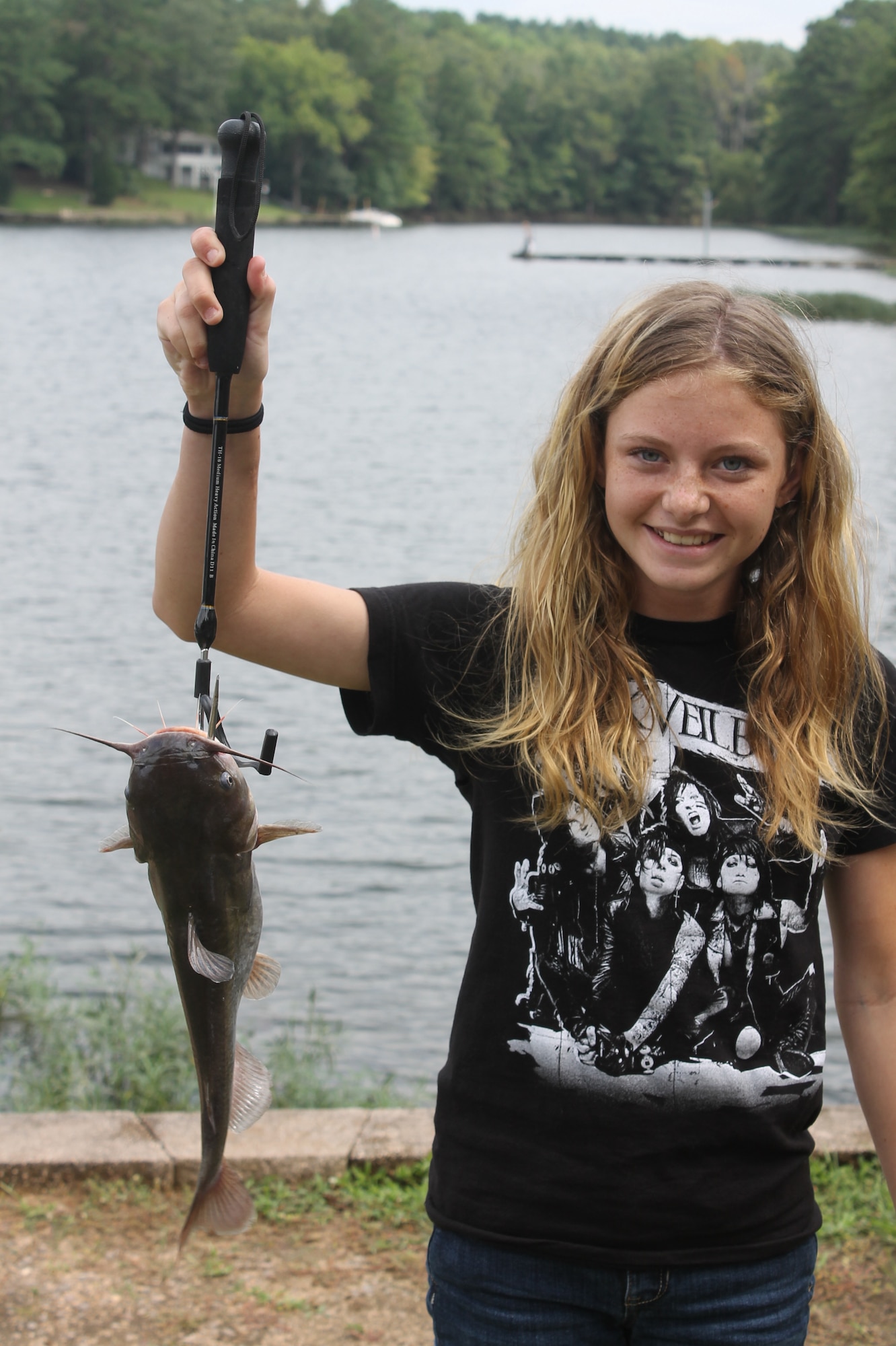 Taylor Boatwright poses with a catfish she caught during the 7th Annual End of Summer Kids Fishing Tournament at the Wateree Recreation Area, S.C., Aug. 24, 2013. The catfish weighed 1 pound, 10 ounces and was the largest fish caught during the tournament. (Courtesy photo by Curt Marshall)