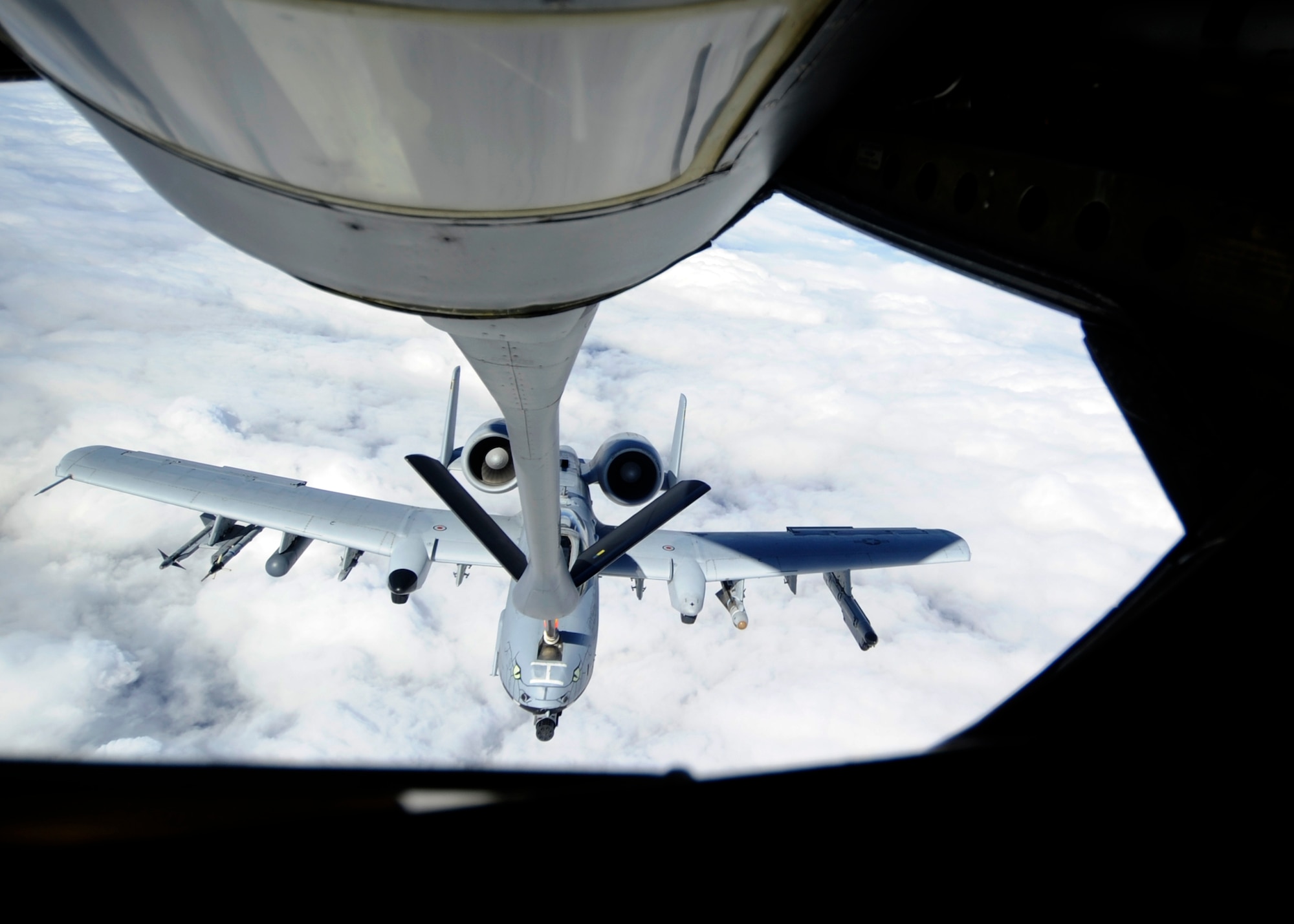 An A-10 Thunderbolt II from the 163rd Fighter Squadron, Indiana Air National Guard, Ft. Wayne, Ind., approaches a KC-135 Stratotanker from Kadena Air Base, Japan, for refueling during during RED FLAG-Alaska 13-3, Aug. 21, 2013, Eielson Air Force Base, Alaska. RF-A enables joint and international units to sharpen their combat skills by flying simulated combat sorties in a realistic threat environment. (U.S. Air Force photo by Senior Airman Shawn Nickel/Released)