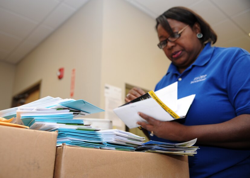 Sharron Jackson, Official Mail Center manager, checks incoming mail to make sure of its distribution on Barksdale Air Force Base, La., Aug. 27, 2013. The United States Postal Service delivers mail to the OMC and it is the job of the employees to ensure all mail arrives to the appropriate units. (U.S. Air Force photo/Senior Airman Joseph A. Pagán Jr.)