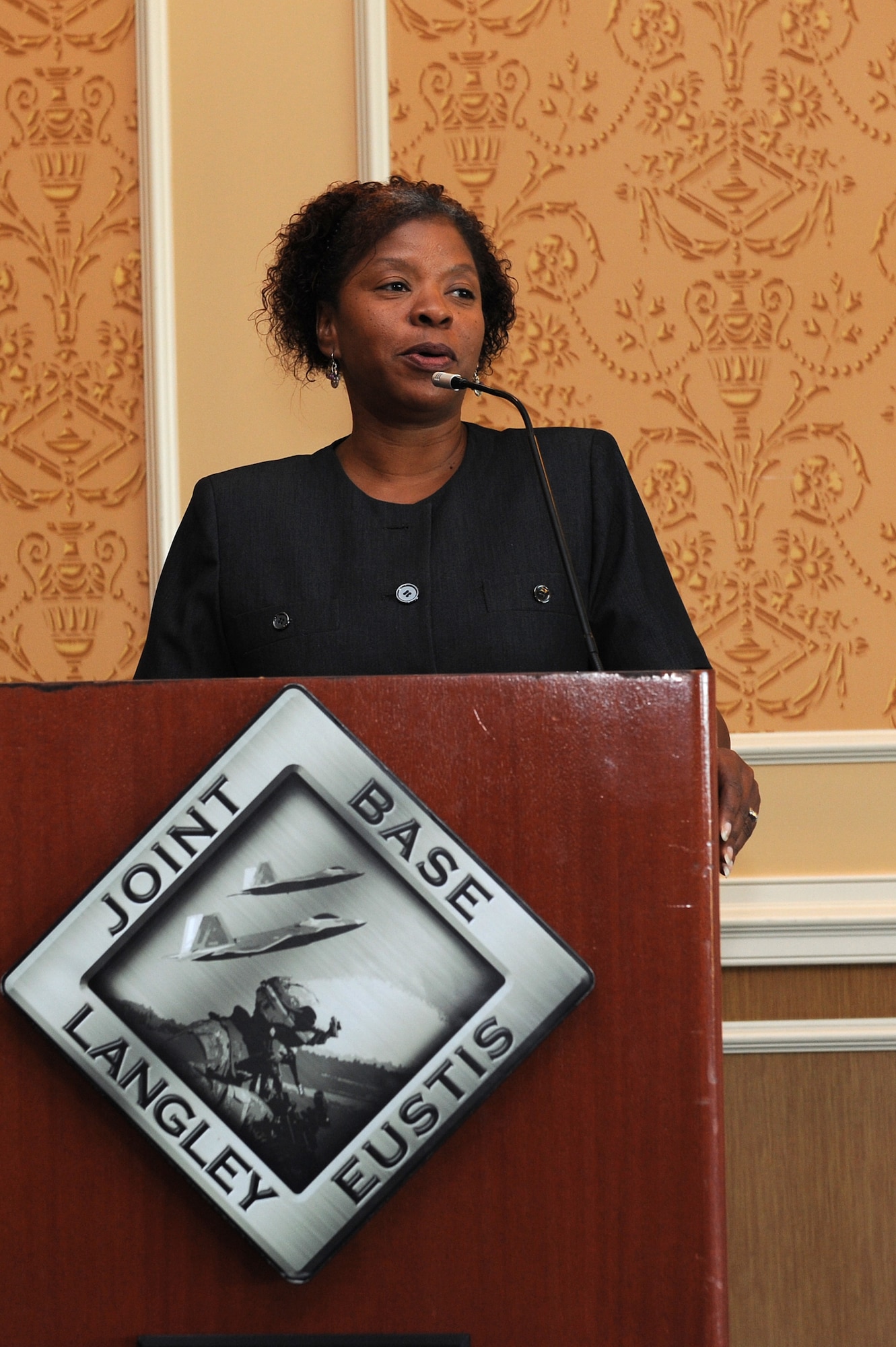 Julie Williams-Byrd shares personal stories during the Women’s Equality Day Luncheon at Langley Air Force Base, Va., Aug. 26, 2013. Williams-Byrd spoke during the luncheon about the importance of opportunities for women in the workforce. (U.S. Air Force photo by Senior Airman Brittany Paerschke-O’Brien/Released)