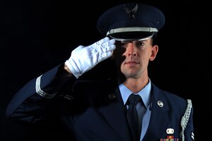 U.S. Air Force Airman 1st Class Ross Heintzkill, , Langley Air Force Base Honor Guard ceremonial guardsman head trainer, performs a salute after graduating LAFBHG at Langley AFB, Va., Aug. 27, 2013. The Base Honor Guard head trainer is responsible for ensuring the Airmen in the incoming flight ia capable of accomplishing their duties. (U.S. Air Force photo by Airman 1st Class Victoria H. Taylor/Released)
