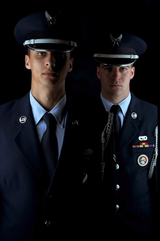 U.S. Air Force Airmen 1st Class Matthew Mendez and Airmen 1st Class Samuel Fulton of the Langley Air Force Base Honor Guard ceremonial guardsmen dress in their ceremonial blues after completeing their 90-day rotation at Langley AFB, Va., Aug. 27, 2013. The U.S. Air Force Honor Guard’s mission is to represent the Air Force and uphold a legacy of Airmen who promote the mission, protect standards, perfect the image and preserve the heritage of the organization. (U.S. Air Force photo by Airman 1st Class Victoria H. Taylor/Released)