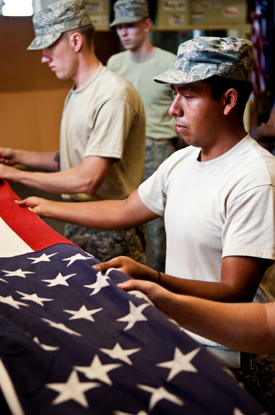 U.S. Air Force Airman 1st Class Yovani Calvillo, Langley Air Force Base Honor Guard ceremonial guardsman, practices a 7-man funeral ceremony at Langley AFB, Va., Aug. 26, 2013. Incoming ceremonial guardsmen are taught by senior members and appointed trainers that are further along in the program. (U.S. Air Force photo by Airman 1st Class Victoria H. Taylor/Released)