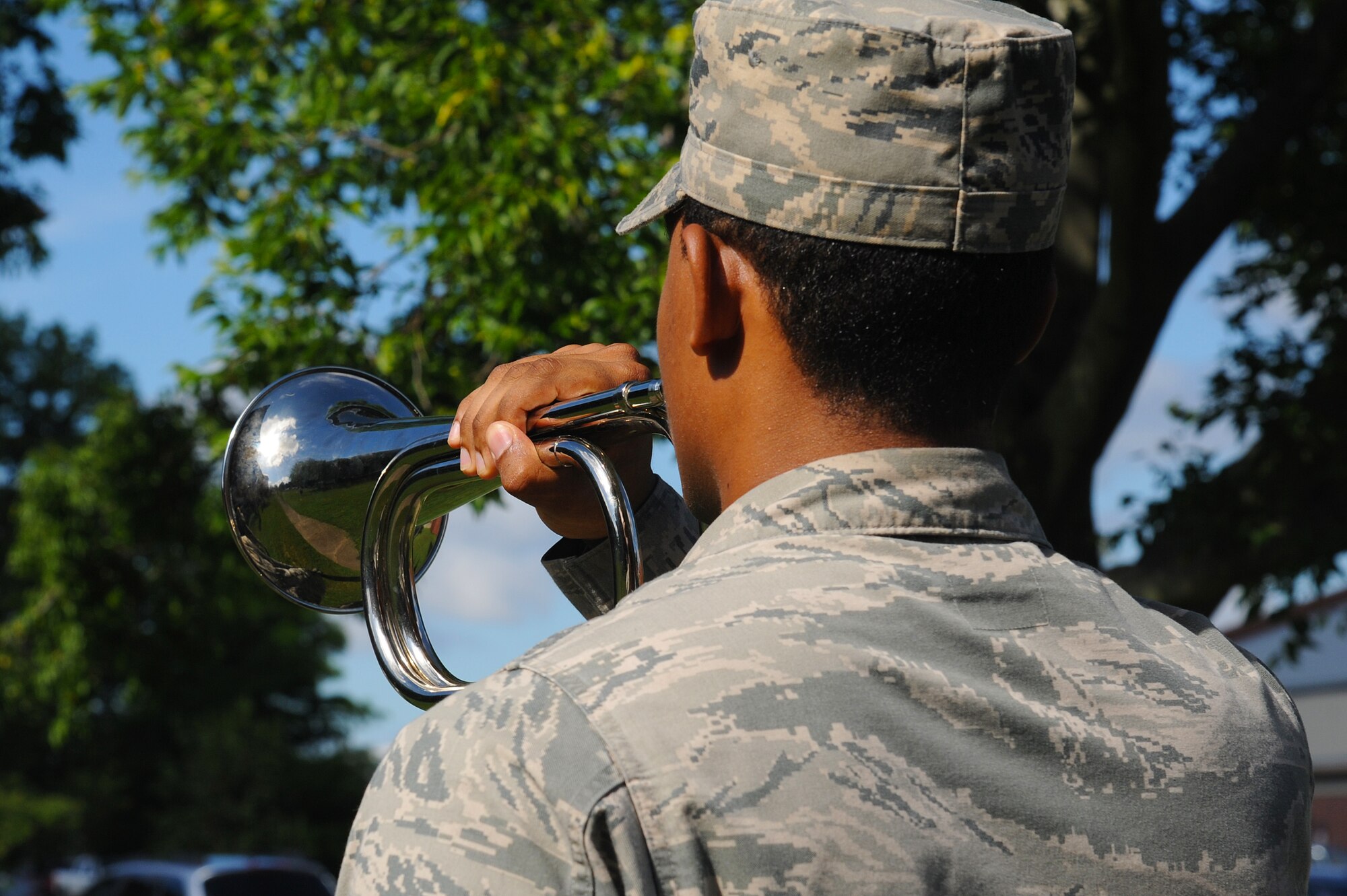 U.S. Air Force Airman 1st Class Steven Hughes, Langley Air Force Base Honor Guard ceremonial guardsman, stands at attention during an evaluation at Langley AFB, Va., July 17, 2013. While training to become a ceremonial guardsman, Airmen are taught multiple drills and procedures over a 90-day rotation. (U.S. Air Force photo by Airman 1st Class Victoria H. Taylor/Released)