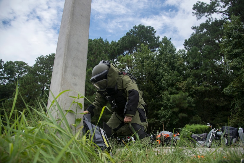 Staff Sgt. Aaron Clark, 628th Civil Engineer Squadron explosive ordnance disposal technician, preps the simulated suspect device to be x-rayed during an exercise Aug. 22, 2013 at Joint Base Charleston - Weapons Station, S.C. The scenario was one of many that tested JB Charleston to perform their duties under heightened security conditions during a routine security exercise. (U.S. Air Force photo/Tech. Sgt. Rasheen Douglas)