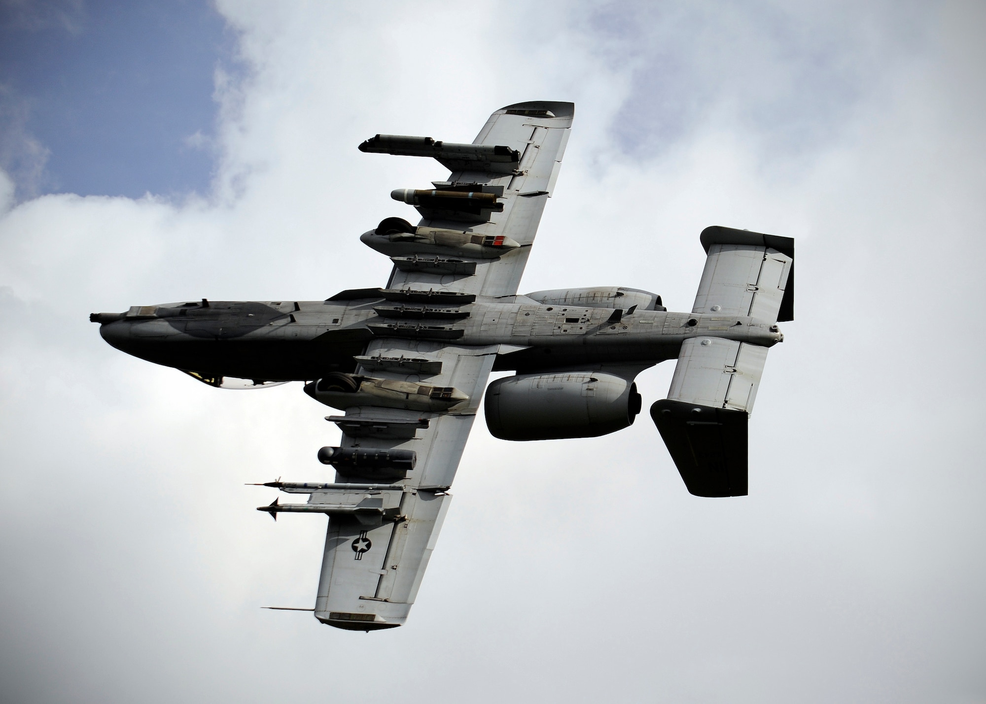 An A-10 Thunderbolt II from the 163rd Fighter Squadron, Indiana Air National Guard, Ft. Wayne, Ind., does a show of force maneuver after locating a simulated downed pilot during RED FLAG-Alaska 13-3, Aug. 22, 2013, Eielson Air Force Base, Alaska.  Two A-10s defended the pilot's position until a rescue by the 210th Rescue Squadron could be made. (U.S. Air Force photo by Senior Airman Shawn Nickel/Released)