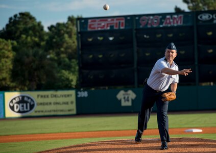 Col. Frederick Boehm, 437th Operations Group commander, throws the first pitch during the Charleston RiverDogs Military Appreciation Night game Aug. 21, 2013, at Joseph P. Riley Jr. park in Charleston, S.C. He was one of three commanders who threw the first pitch for the night. The Charleston RiverDogs hosted Military Appreciation night to show their support for the local military. (U.S. Air Force photo/Tech. Sgt. Rasheen Douglas)