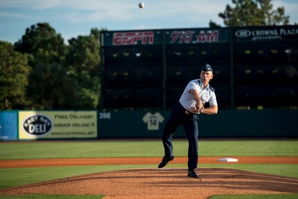 Col. Scott Sauter, 315th vice wing commander, throws the first pitch during the Charleston RiverDogs Military Appreciation Night game Aug. 21, 2013, at Joseph P. Riley Jr. park in Charleston, S.C. He was one of three commanders who threw the first pitch for the night. The Charleston RiverDogs hosted Military Appreciation night to show their support for the local military. (U.S. Air Force photo/Tech. Sgt. Rasheen Douglas)