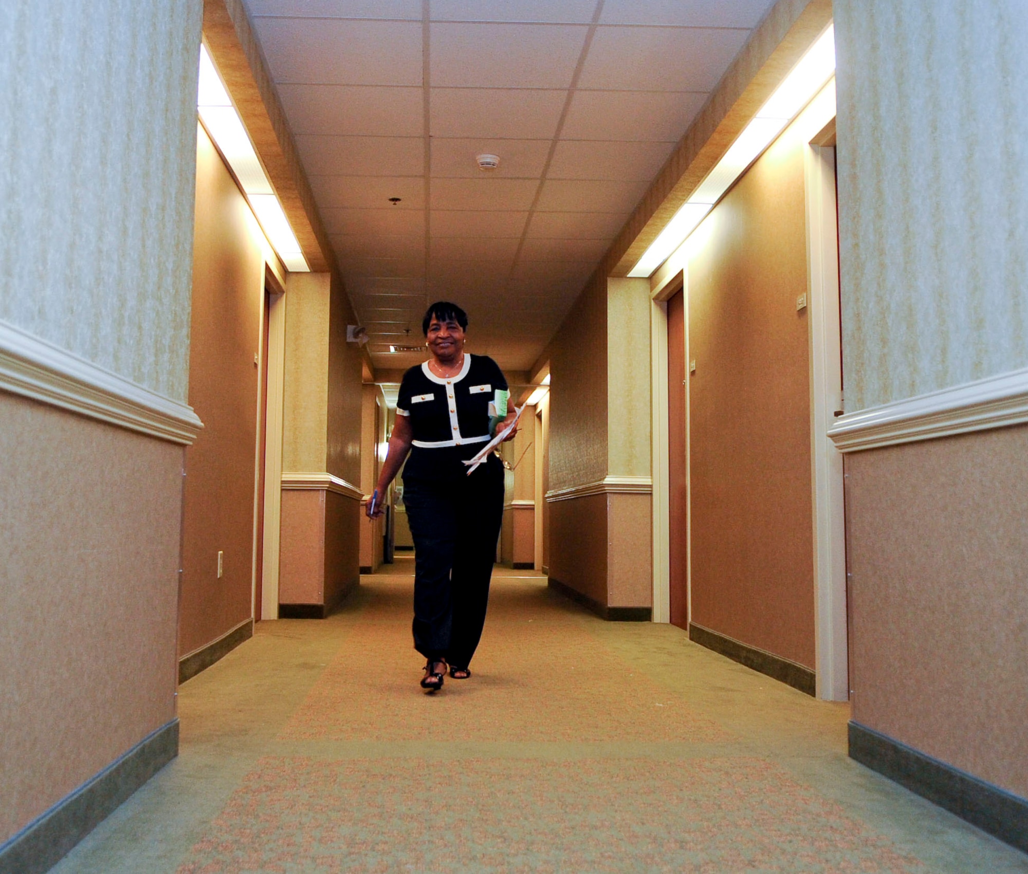Anita Jefferson, General Smalls Inn housekeeping supervisor, makes her rounds at the inn Aug. 20, 2013, at Fort Eustis, Va. Jefferson celebrates 50 years of working at Fort Eustis lodging this September. (U.S. Air Force photo by Staff Sgt. Wesley Farnsworth/Released)