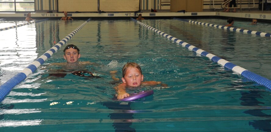Brandon Gaither approaches the end of the swimming portion of the Kids Wellness Triathlon at Fairchild Air Force Base, Wash., Aug. 24, 2013.  Seventy kids participated in the event.  (U.S. Air Force photo by Airman 1st Class Sam Fogleman/Released)