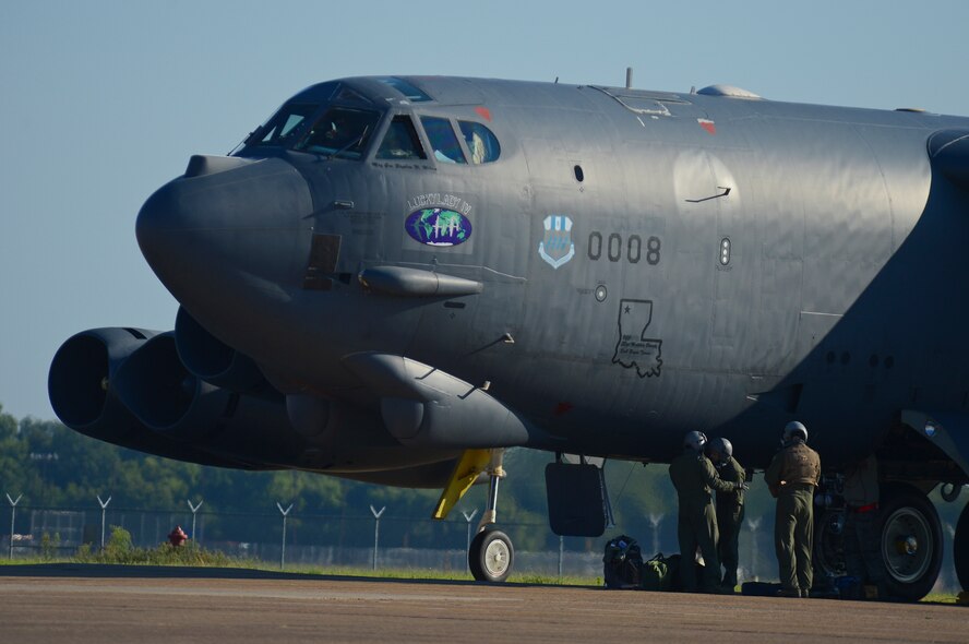 Aircrew from the 20th Bomb Squadron prepare to enter a B-52H Stratofortress on Barksdale Air Force Base, La., Aug. 26, 2013. Once the crew and their equipment were loaded, the B-52 crew departed for Anderson AFB, Guam, to support the continuous bomber presence in the Pacific. (U.S. Air Force photo/Senior Airman Micaiah Anthony)