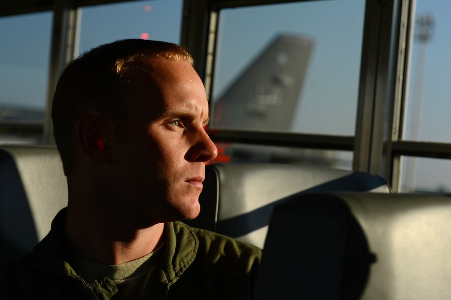 Capt. Jordan Filer, 20th Bomb Squadron instuctor pilot, looks out the window of a bus on Barksdale Air Force Base, La., Aug. 26, 2013. Airmen from the 20th BS deployed to Anderson AFB, Guam, to support the continuous bomber presence in the Pacific region. (U.S. Air Force photo/Senior Airman Micaiah Anthony)