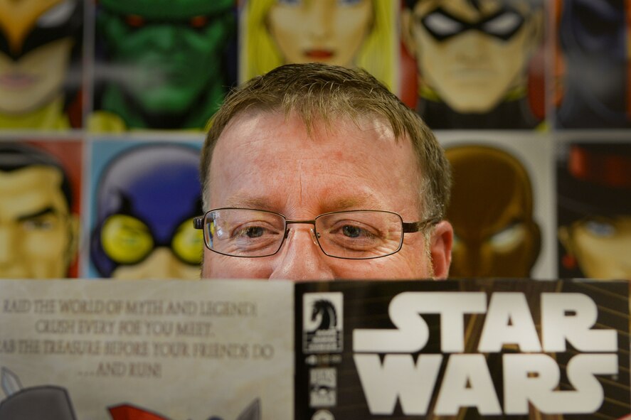 Barry Edwards, Nuklear Comix owner and a U.S. Army veteran, reads through a Star Wars collection comic book, Sumter, S.C., Aug. 24, 2013. Edwards has been reading comic books for more than 30 years. The veteran started the store from his own private collection of comic books in November 2012. (U.S. Air Force photo by Airman 1st Class Ashley L. Gardner/Released)