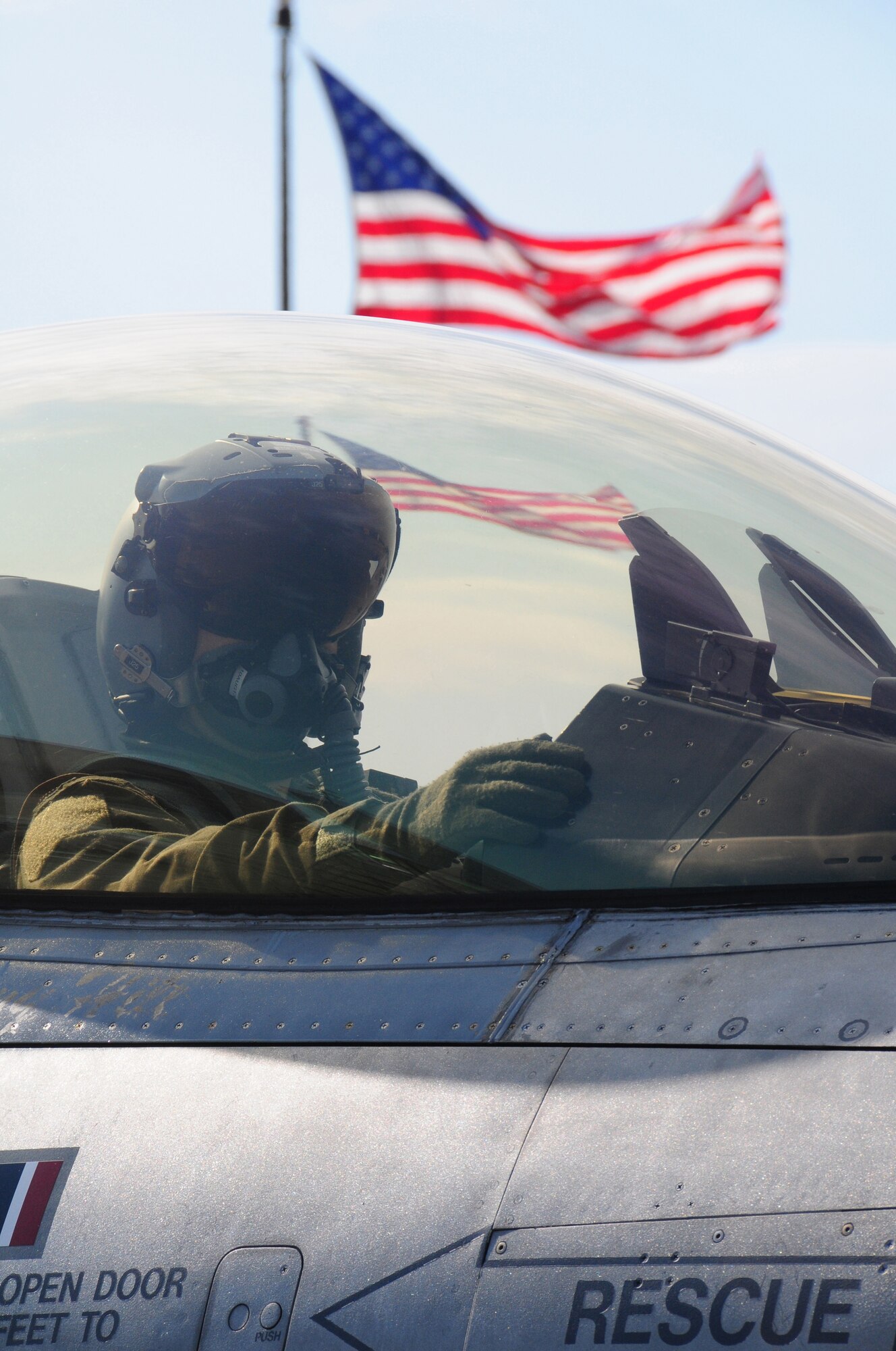 A 148th Fighter Wing F-16 pilot waits to get the go-ahead to taxi while participating in a Readiness Exercise in Duluth, Minn., July 20, 2013.  The Air Combat Command (ACC) Inspector General team evaluated the 148FW during a Readiness Inspection (RI), Aug. 22-24, 2013, the wing received an overall grade of excellent.   (U.S. Air National Guard photo by Master Sgt. Ralph J. Kapustka/Released)