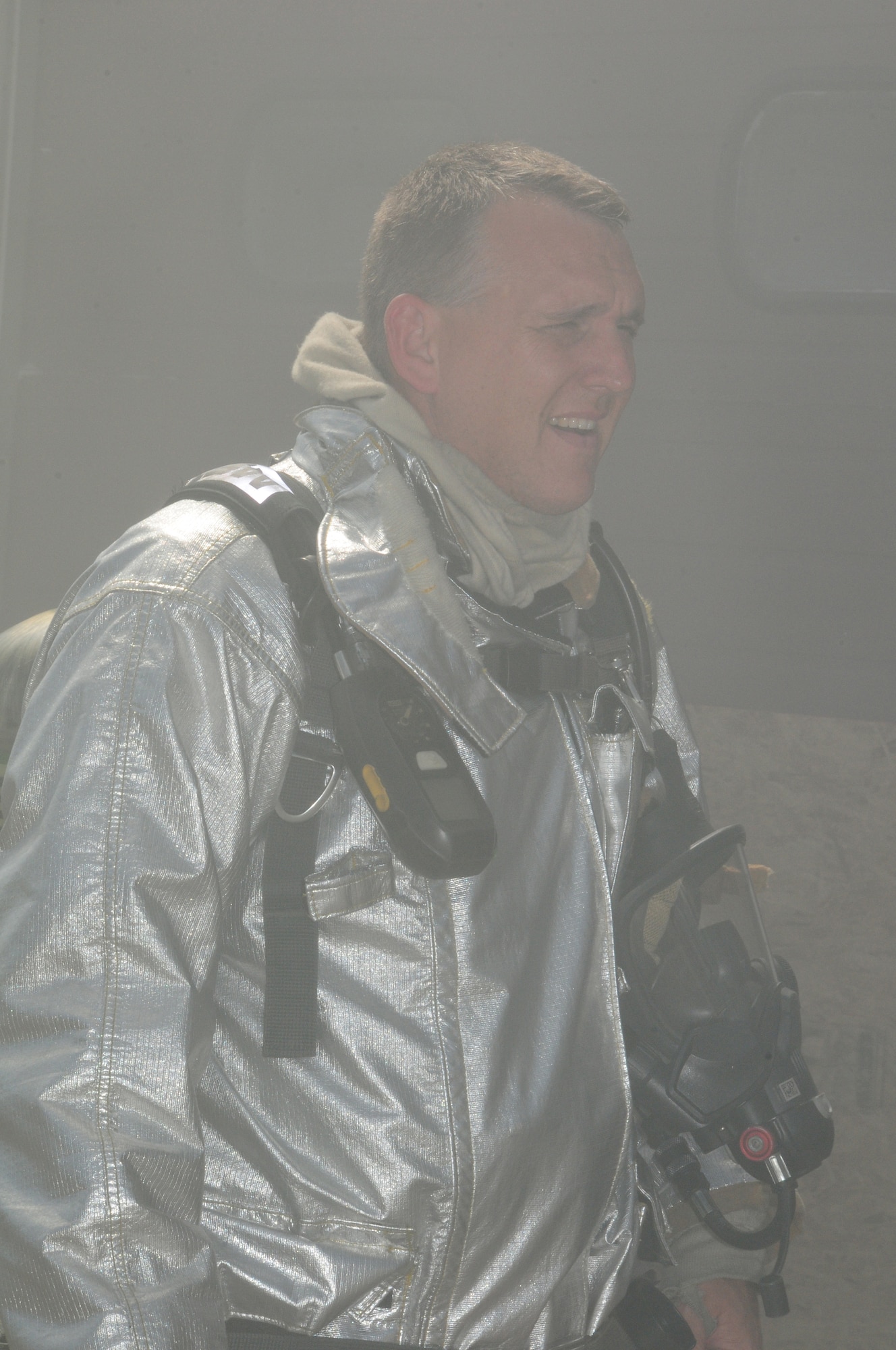 A 148th Fighter Wing, Duluth, Minn. firefighter takes a breather after participating in a Readiness Exercise scenario on July 20, 2013.  The Air Combat Command (ACC) Inspector General team evaluated the 148FW during a Readiness Inspection (RI), Aug. 22-24, 2013, the wing received an overall grade of excellent.  (U.S. Air National Guard photo by Master Sgt. Ralph J. Kapustka/Released)