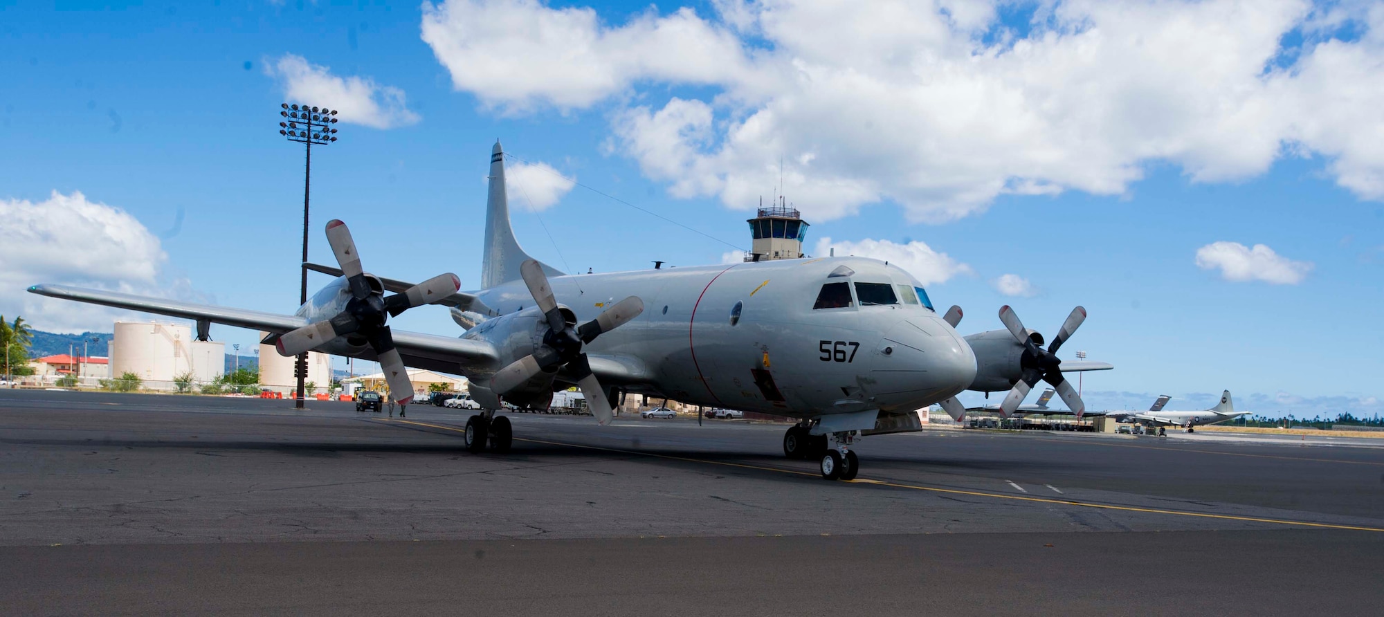 A Navy P-3C Orion aircraft lands on the flightline at Joint Base Pearl Harbor-Hickam, Hawaii, Aug. 23, 2013. The aircraft is assigned to Patrol Squadron Nine at Marine Corps Base Hawaii, which will operate temporarily out of JBPH-H while the MCBH runway undergoes renovations.  During the 60-day renovation, the unit will continue to perform its primary mission of anti-submarine warfare, anti-surface warfare and intelligence, surveillance and reconnaissance. (U.S. Air Force photo/Staff Sgt. Terri Paden)