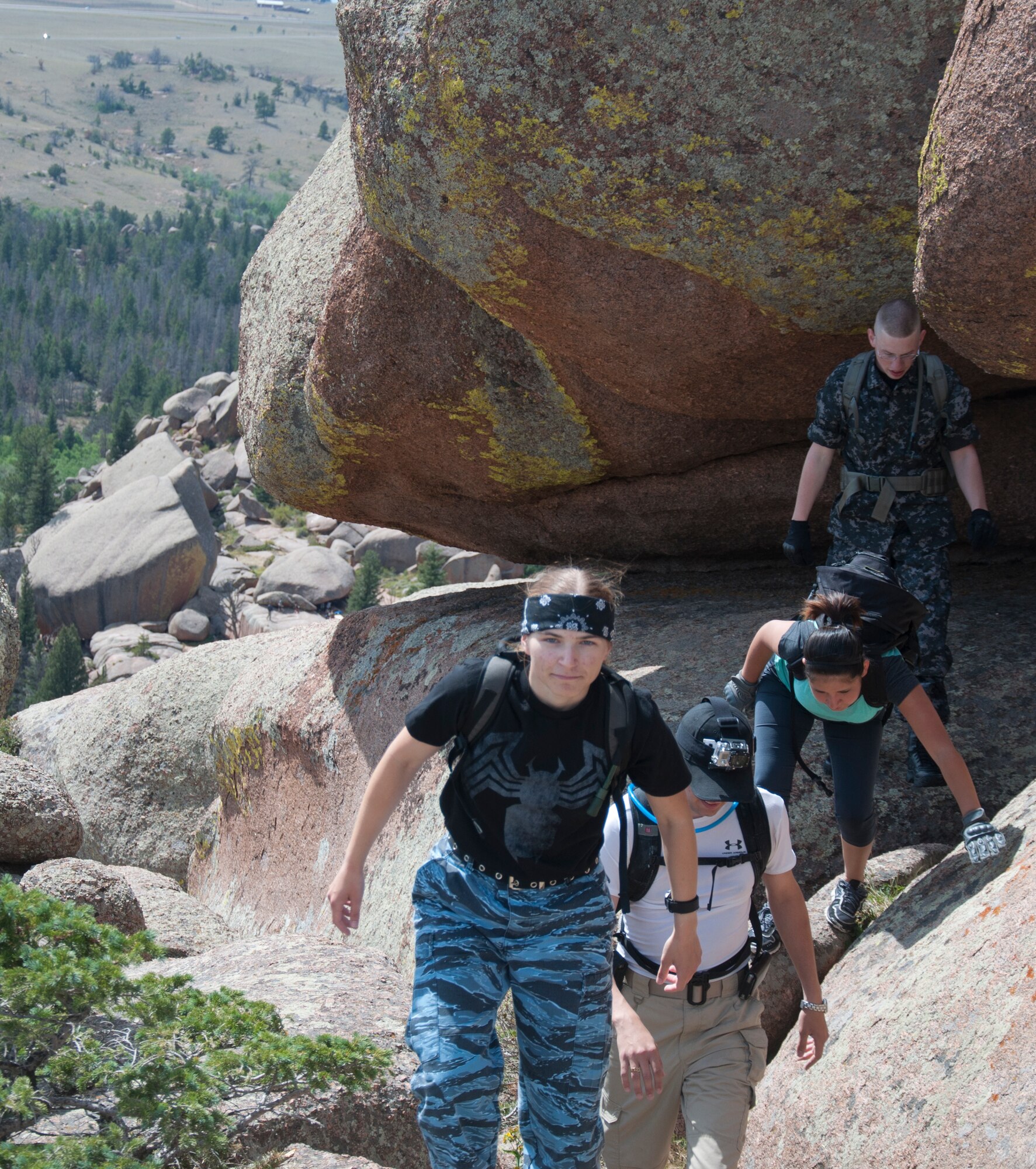 130824-F-GZ967-026 Airman 1st Class Julia Bullock, 90th Communications Squadron, leads a group of Airmen as hike their way up the hills of Vedauwoo, Wyo., Aug. 24, 2013. The group of Airmen included Airman 1st Class Matthew Lennard, 90th Civil Engineer Squadron; Airman 1st Class Tatiana Gonzalez, 790th Missile Security Forces Squadron; Airman 1st Class Cameron Dooley, 90th Comptroller Squadron; and Airman 1st Class Brandon Valle, 90th Missile Wing Public affairs. (U.S. Air Force photo by Airman 1st Class Brandon Valle)
