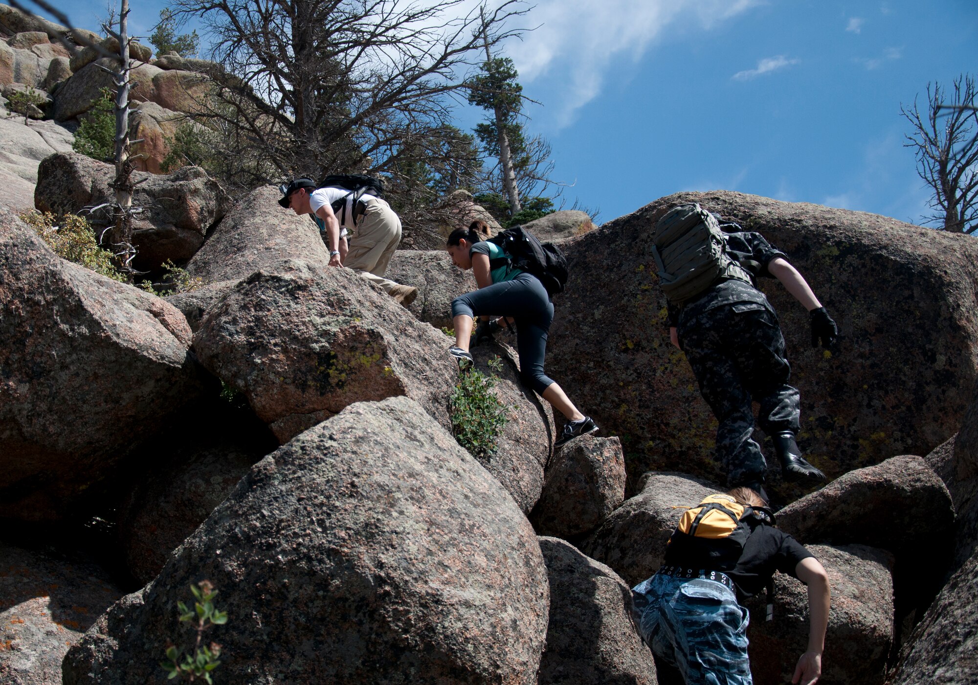 130824-F-GZ967-010 Airman 1st Class Cameron Dooley, 90th Comptroller Squadron customer service technician, leads a group of Airmen as they begin their climb of the rocky hills of Vedauwoo, Wyo., Aug. 24, 2013. The group went hiking as a way to spend time outdoors and build teamwork with each other. (U.S. Air Force photo by Airman 1st Class Brandon Valle)