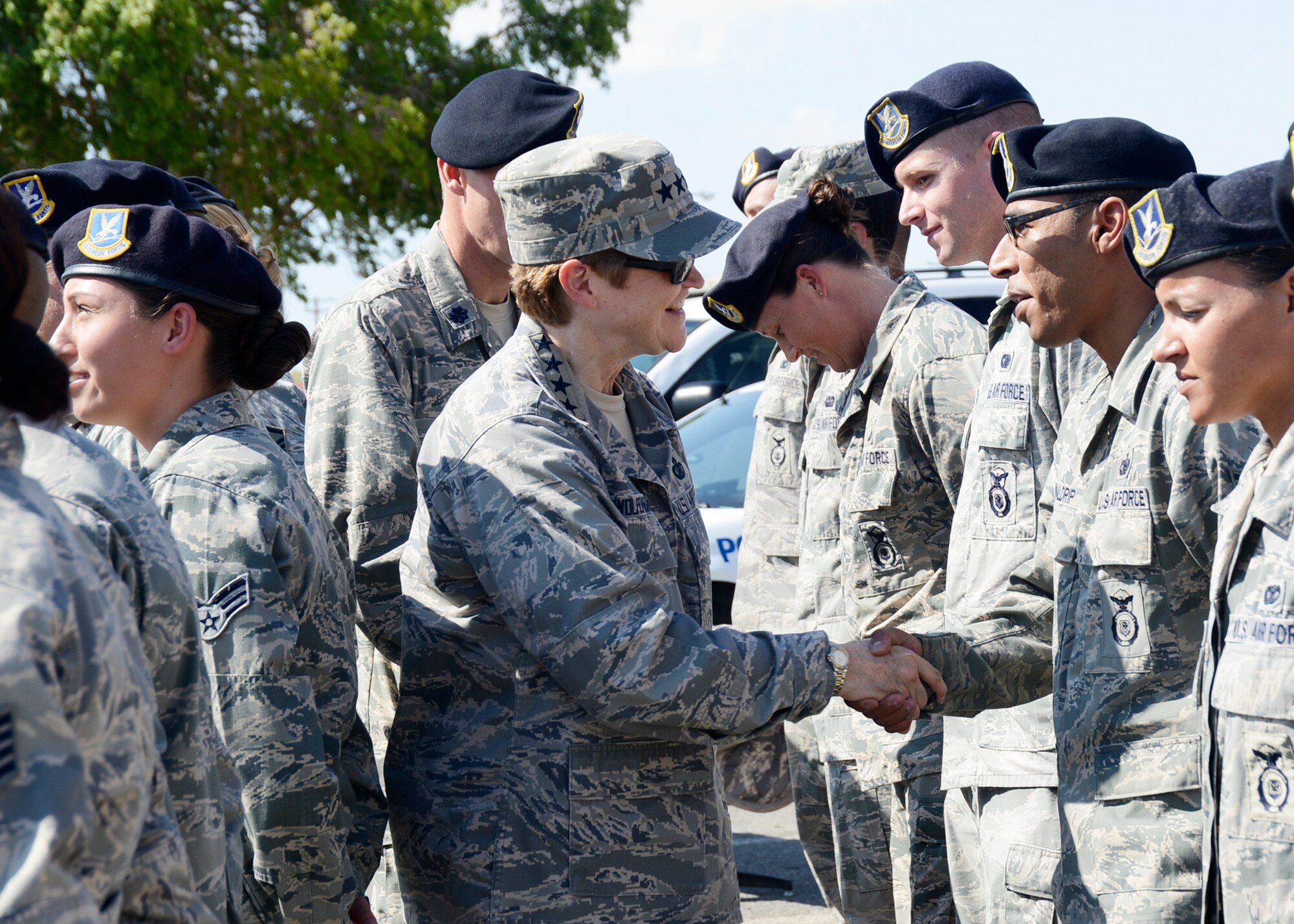 Gen. Janet C. Wolfenbarger, Air Force Materiel Command commander, greets Airmen from the 412th Security Forces Squadron Aug. 22. The visit to SFS and the armory was towards the end of a day-long tour of Edwards AFB facilities.  The general was in town to receive briefs on current Edwards test programs and to officiate Maj. Gen. Arnold W. Bunch Jr.'s promotion ceremony held Aug. 23 in the Base Theater. (U.S. Air Force photo by Rebecca Amber)