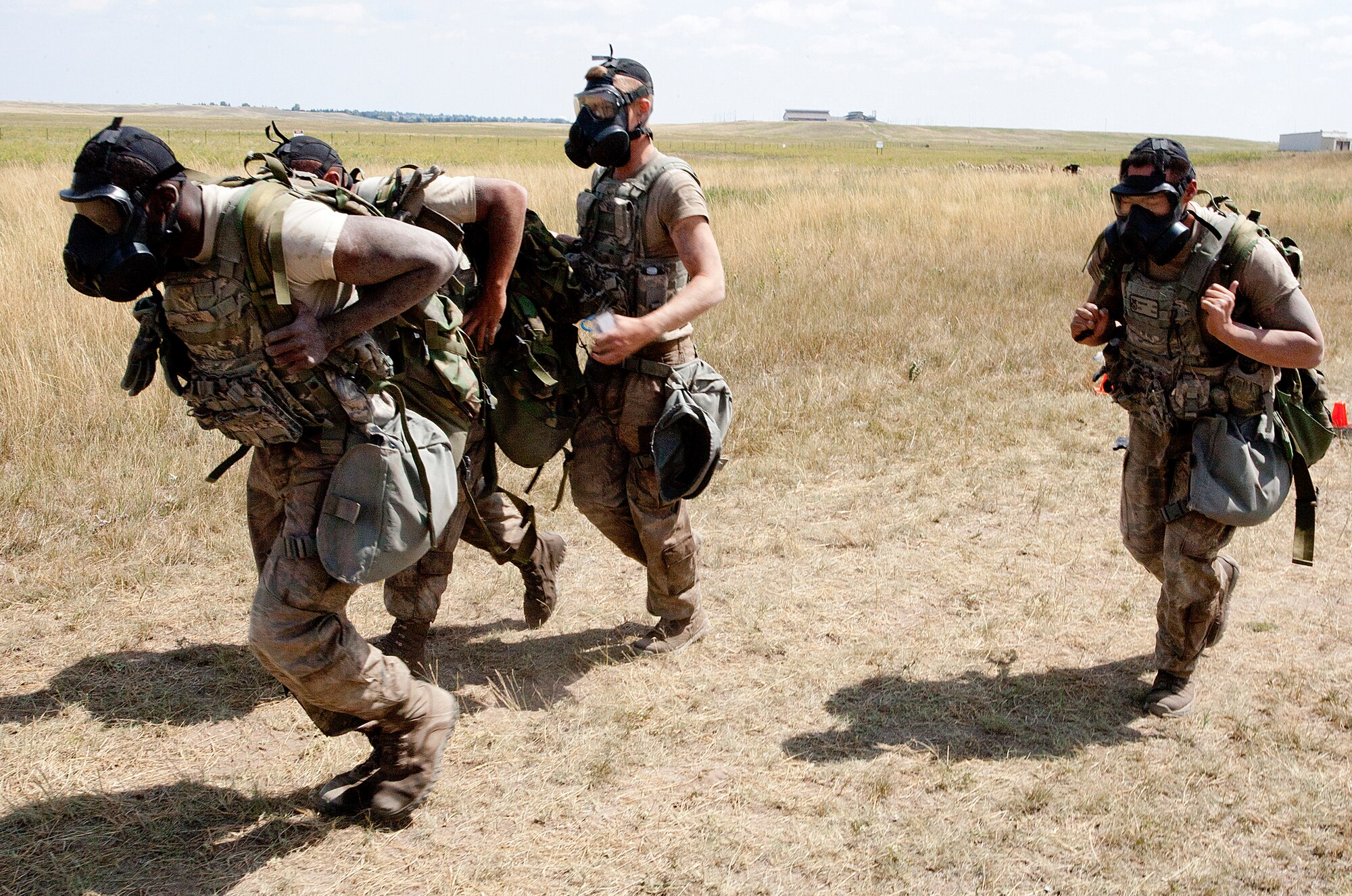 130822-F-JW079-0846
Airmen of the 790th Missile Security Forces Squadron Camper Support Team 2 compete in the “ruck and run” event of the F.E. Warren Air Force Base, Wyo., Crow Creek Challenge Aug. 22, 2013. Airmen 1st Class Charlie Jones, James Wood and Richard Lam took part in the 20th annual competition which challenges 90th Security Group Airmen to the limits of their physical and mental endurance. (U.S. Air Force photo by R.J. Oriez)

