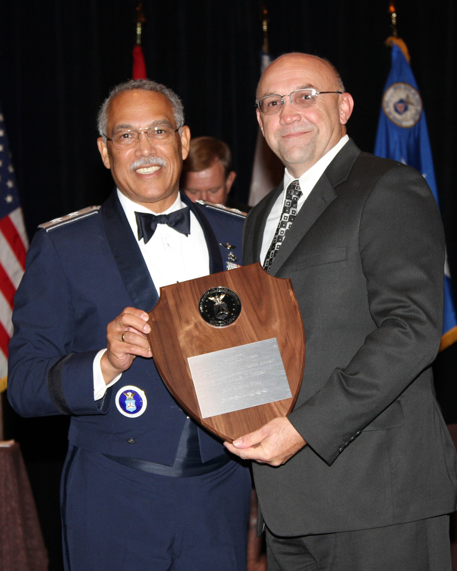 Maj. Gen Charles L. Carr, National Commander of CAP awards Michael E. Eckert a ground safety professional at the Air Force Safety Center the F. Ward Reilly Leadership Award at the Civil Air Patrol National Conference in Denver, Colo.  Aug. 15-17.