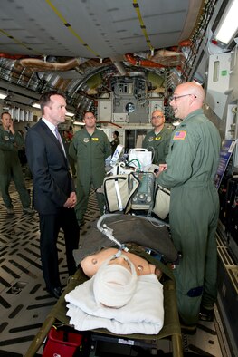 Acting Secretary of the Air Force Eric Fanning receives a critical care air transportation team brief by Col. Scott Vandehoef, 60th Medical Operations Squadron emergency services flight commander, inside a C-17 Globemaster III Aug. 22 at Travis Air Force Base, Calif. The CCATT is responsible for the airborne transportation of critically ill patients. (U.S. Air Force photo/Heide Couch)