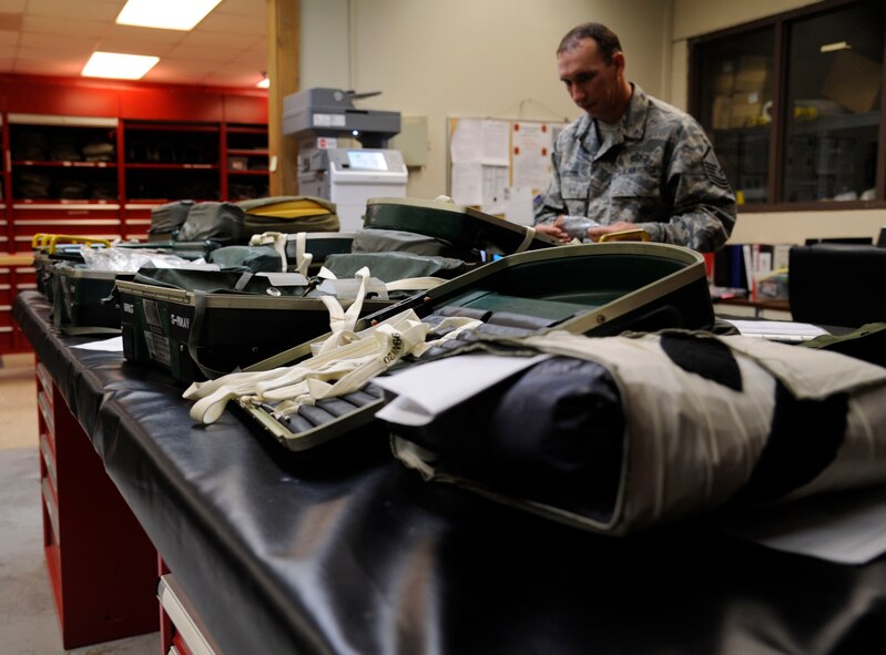 CNU-129P Survival Kits are laid out prior to inspection by Master Sgt. Chris Scott, 2nd Operations Support Squadron NCO in-charge of Quality Assurance, on Barksdale Air Force Base, La., Aug. 27, 2013. The kits are inspected annually to ensure the items within are not expired and to maintain the serviceability of equipment. (U.S. Air Force photo/Airman 1st Class Andrew Moua)