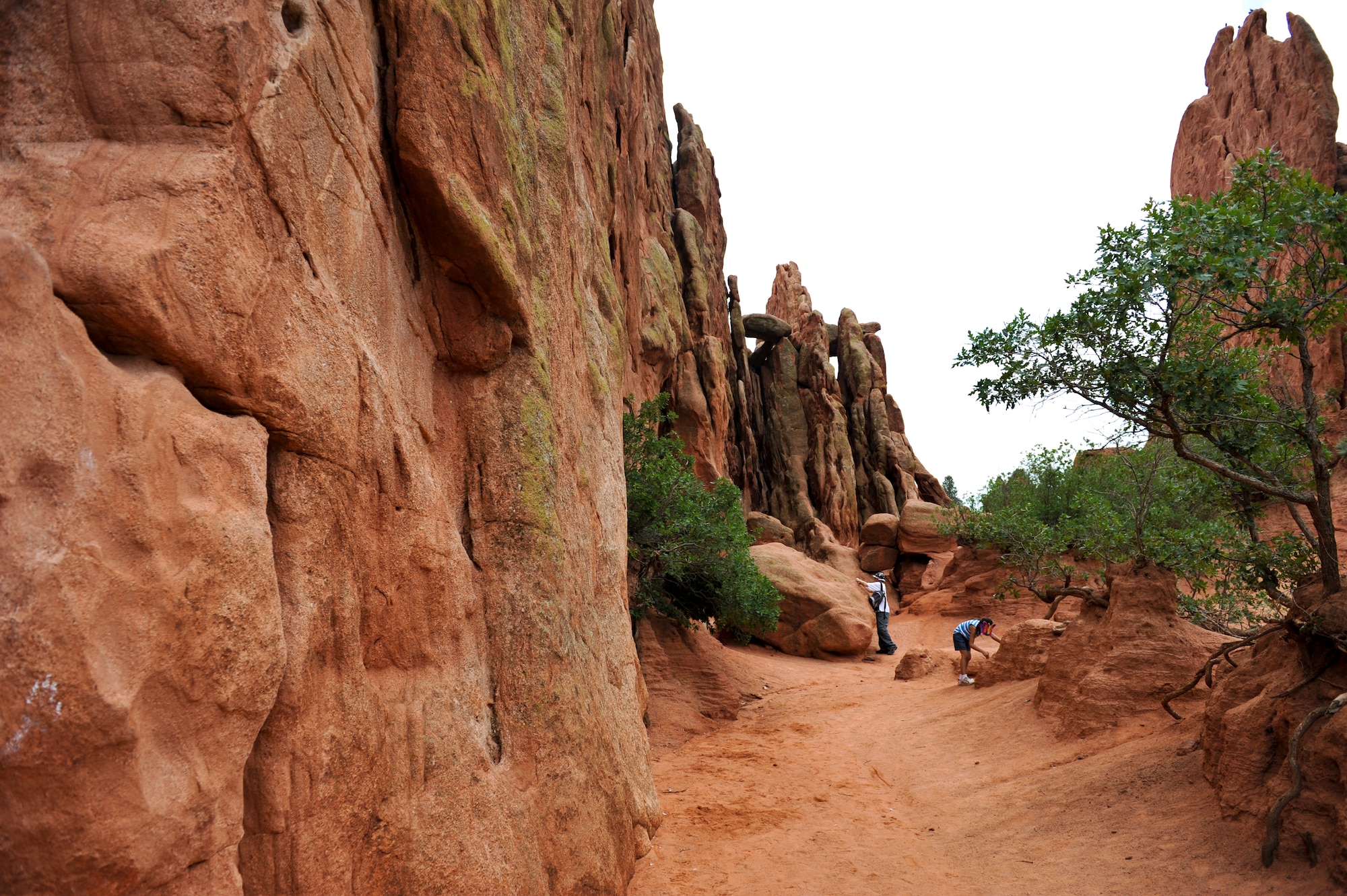 Park visitors explore rock features at the Garden of the Gods Aug. 17, 2013, Colorado Springs, Colo. The park boasts several red and white stone formations, including Cathedral Rock, Balanced Rock and Kissing Camels. (U.S. Air Force photo by Airman 1st Class Riley Johnson/Released)