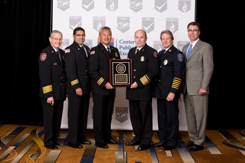 (Left to right) Randy Bruegman, Center for Public Safety Excellence President; Chris Soliz, Cheyenne Mountain Fire and Emergency Service assistant chief; David Arcilla, CMFES assistant chief; Chris Miller, CMFES fire chief; Gary Curmode, CFAI assessor; and Raymond "Allan" Cain, CFAI chairman pose during the presentation of CMFES’s Accredited Agency plaque. This accreditation is the result of three years of hard work and provides continuous quality improvement and enhancement of service delivery to local communities. (Courtesy photo)