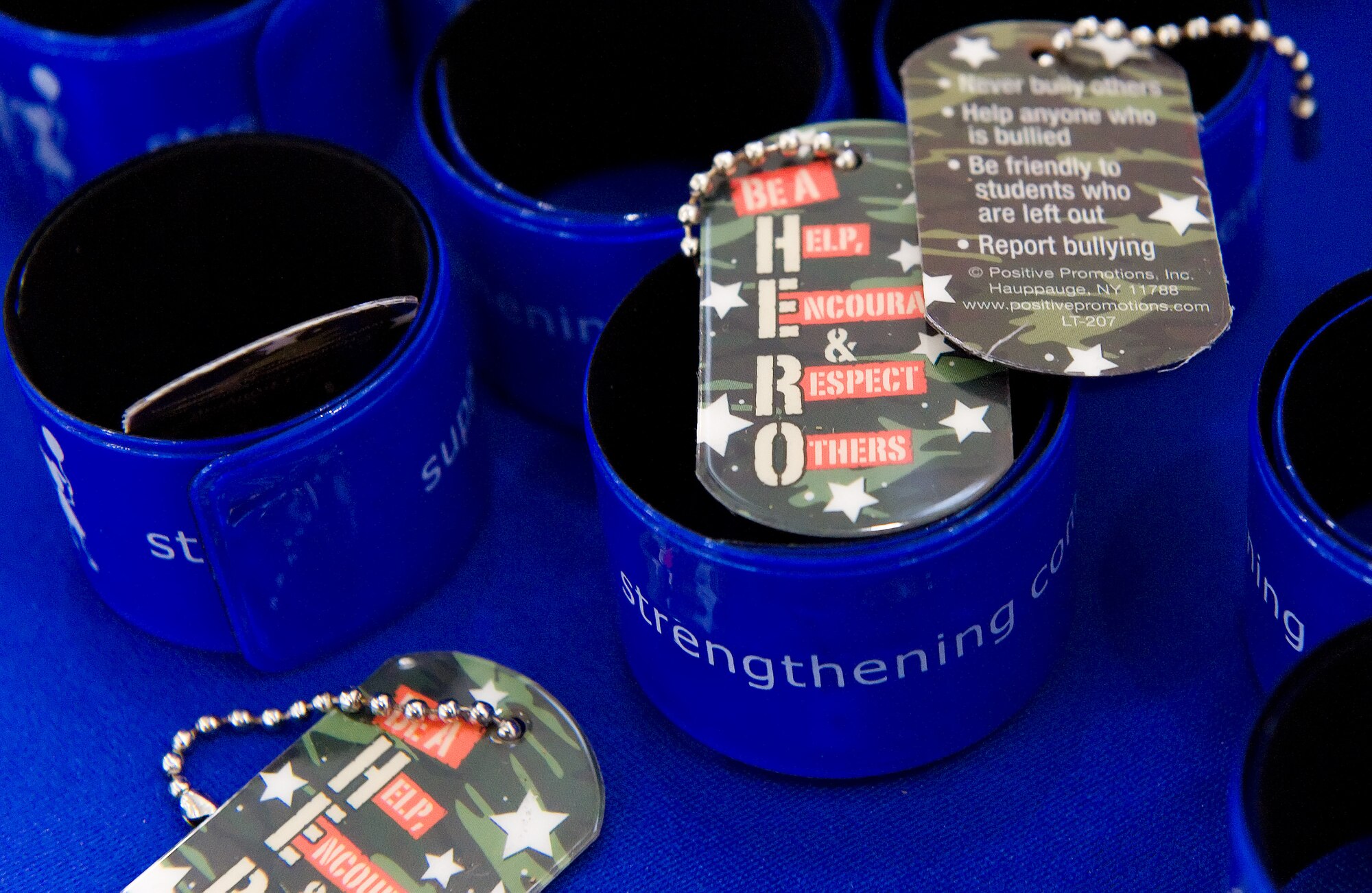 The Dover AFB Family Advocacy Program provided "Be a HERO" dog tags for children processing through the mobility line August 22, 2013, at Dover Air Force Base, Del. The children's mobility line was supported by base agencies such as the Airman and Family Readiness Center, finance, legal, and safety; as well as off-base agencies such as 4-H and Operation Military Kid. (U.S. Air Force photo/Roland Balik)
