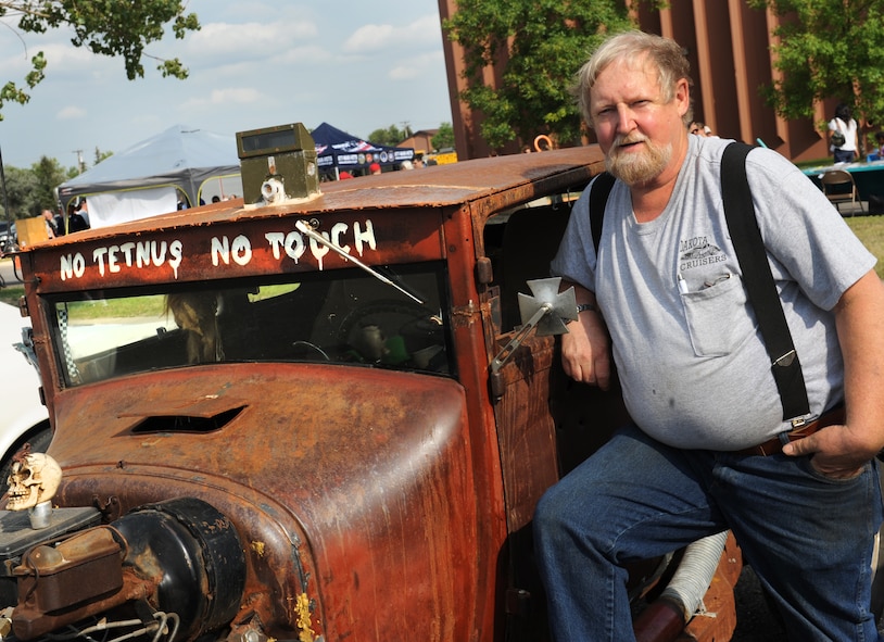 Dave Smith, a Minot native and Air Force retiree, stands next to his 1926 Ford coupe at the end of summer Community Fair, Aug. 23. The community fair was combined with the base's annual block party and car show. This year was Smith's eighth year participating in the car show. (U.S. Air Force photo/Airman 1st Class Apryl Hall)
