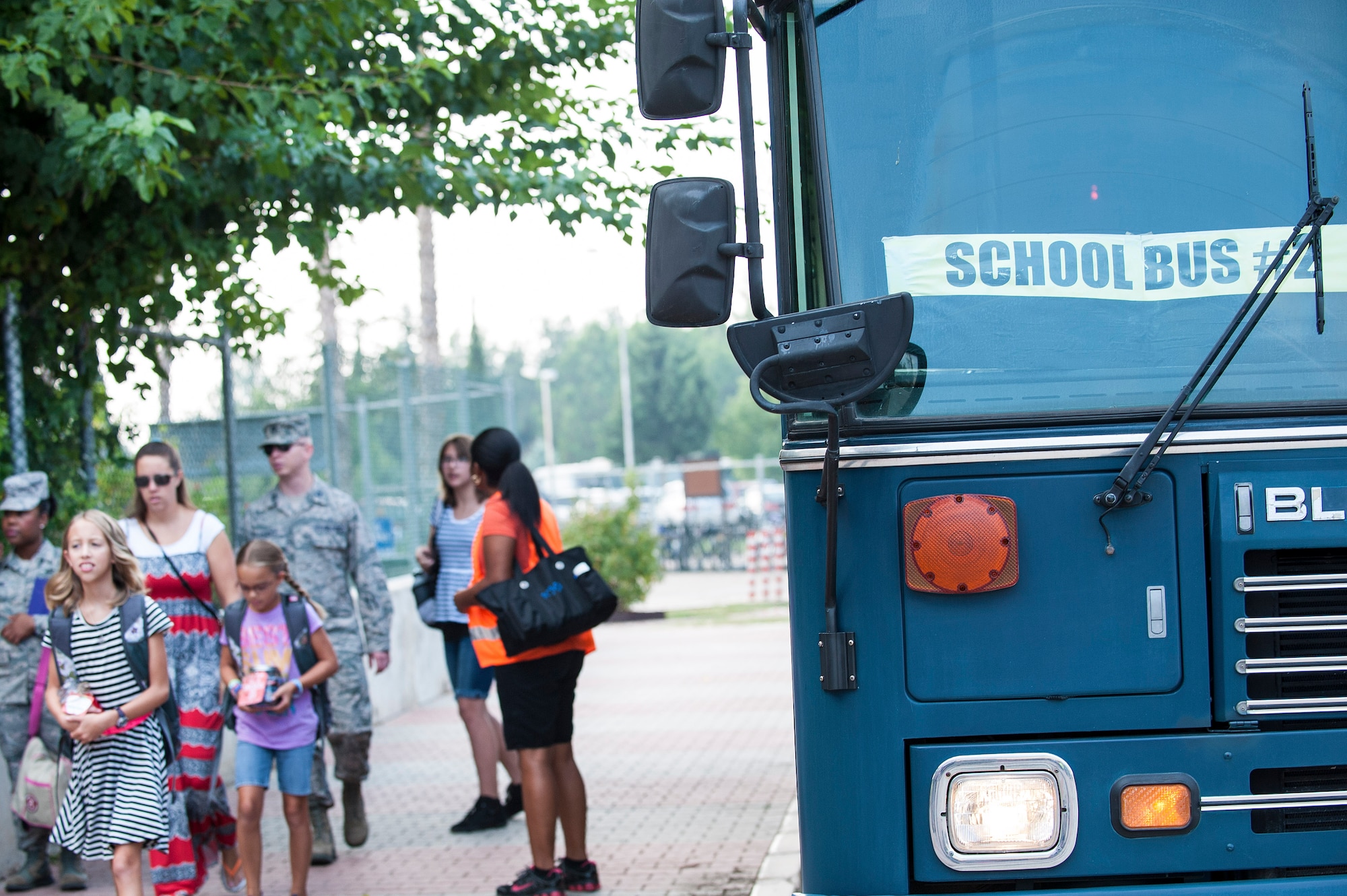 A school bus parks next to Incirlik Unit School Aug. 26, 2013, Incirlik Air Base, Turkey.  The first day of school is a community event at Incirlik AB, during which the wing commander welcomes the new school year with the sounding of the gong. (U.S. Air Force photo by Airman 1st Class Nicole Sikorski/Released)