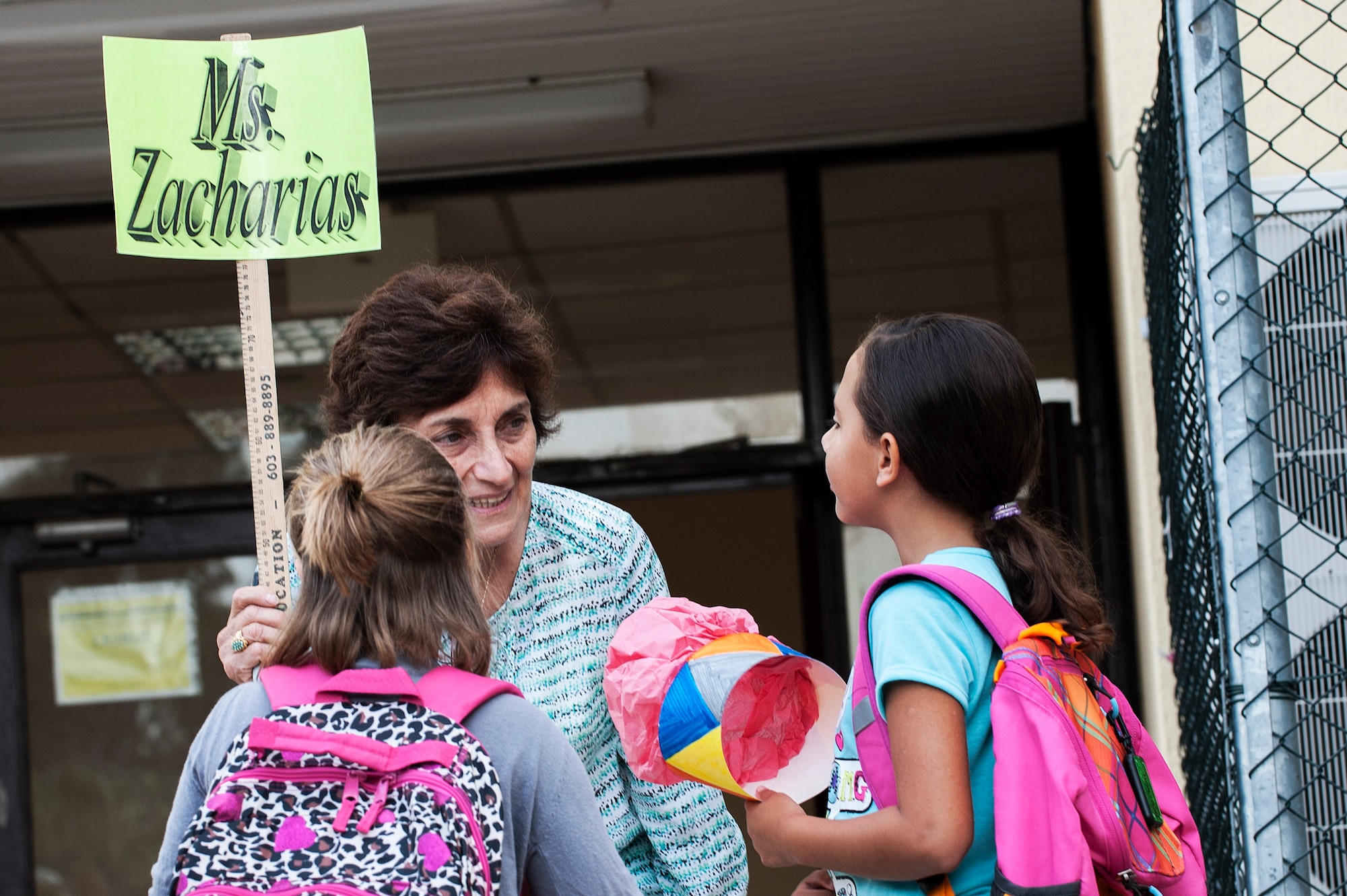 Rose Zacharias, Incirlik Unit School teacher, talks with her students in her third grade class Aug. 26, 2013, Incirlik Air Base, Turkey.  The first day of school is a community event at Incirlik AB, during which the wing commander welcomes the new school year with the sounding of the gong. (U.S. Air Force photo by Airman 1st Class Nicole Sikorski/Released) 