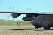 Airmen marshal in a C-130 aircraft during the "Patriot Express" exercise in Pueblo, Colo., Aug. 24. Four ALCF units reserve-wide participated in an annual Air Force Reserve exercise where Airmen operated two contingency response exercises, one in Colorado Springs and another in Pueblo, Colo., with C-17 and C-130's flying between the two locations. (U.S. Air Force photo/SrA. Kelly Galloway)